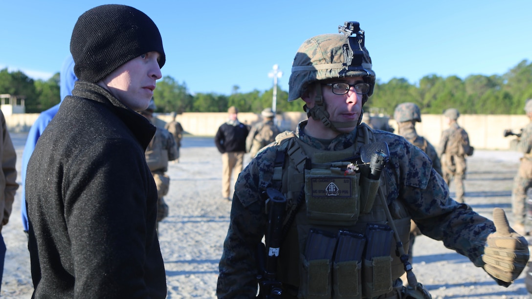 Staff Sgt. Michael Cucinotta, a platoon sergeant with 2nd Battalion, 2nd Marine Regiment, gives instructions to a refugee role player during a noncombatant evacuation training operation at Marine Corps Base Camp Lejeune, North Carolina, Jan. 14, 2016. The Marines successfully processed 28 refugee role players through a notional forward operating base. The exercise was part of the unit’s training in preparation for an upcoming deployment to Okinawa, Japan. 