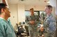 Colonel. James Dienst, right, Air Force Reserve Command Surgeon General, conducts a site visit at the 926th Aerospace Medical Squadron dental clinic here Jan. 9 as the unit prepares to make the transition to using electronic records. Dienst also visited the 726th Operations Group at Creech Air Force Base, Nev., on Jan. 8 to discuss the mental health teams created for Remotely Piloted Aircraft operators. (U.S. Air Force photo/Maj. Jessica D'Ambrosio)