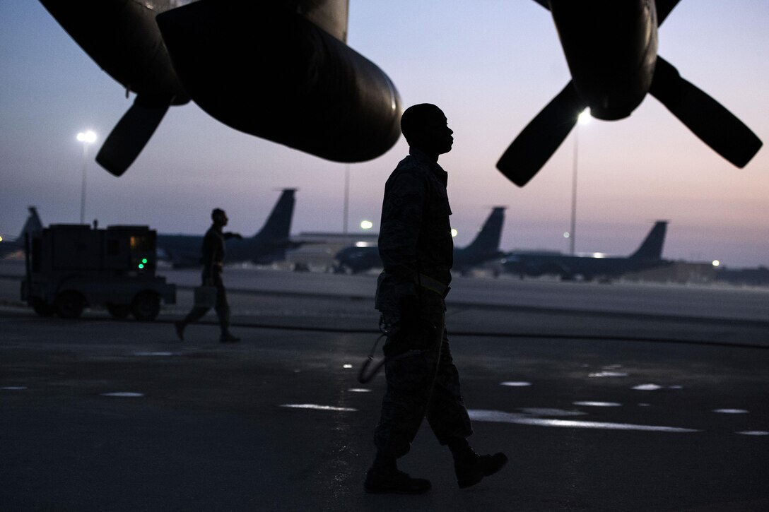 U.S. Air Force Staff Sgt. Charles Raby inspects a C-130H Hercules aircraft while supporting Operation Inherent Resolve on Al Udeid Air Base, Qatar, Jan. 6, 2016. Raby is a crew chief assigned to the 746th Expeditionary Aircraft Maintenance Squadron. U.S. Air Force photo by Tech. Sgt. Nathan Lipscomb