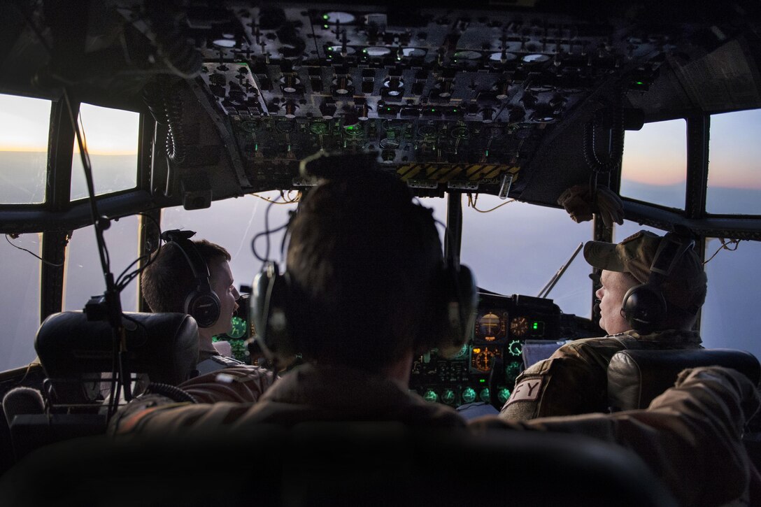 U.S. Air Force pilots fly a C-130H Hercules aircraft transporting injured airmen at an undisclosed location in Southwest Asia to support Operation Inherent Resolve, Jan. 6, 2016. U.S. Air Force photo by Tech. Sgt. Nathan Lipscomb