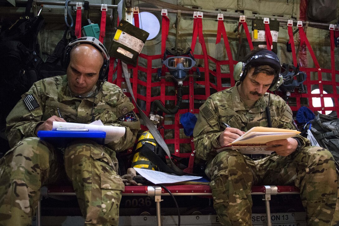 U.S. airmen fill out medical forms for injured airmen at an undisclosed location in Southwest Asia to support Operation Inherent Resolve, Jan. 6, 2016. U.S. Air Force photo by Tech. Sgt. Nathan Lipscomb