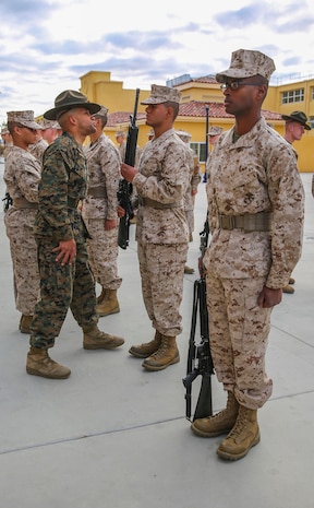 Sergeant Kyle J. Fishe, drill instructor, Fox Company, 2nd Recruit Training Battalion, quizzes a recruit on his knowledge during a series commander inspection at Marine Corps Recruit Depot San Diego, Dec. 28. Drill instructors test recruits to see how much knowledge they’ve retained thus far in recruit training. Recruits take part in a series of classes to learn about such things as the history of the Marine Corps and uniform standards. Annually, more than 17,000 males recruited from the Western Recruiting Region are trained at MCRD San Diego. Fox Company is scheduled to graduate Jan. 29.