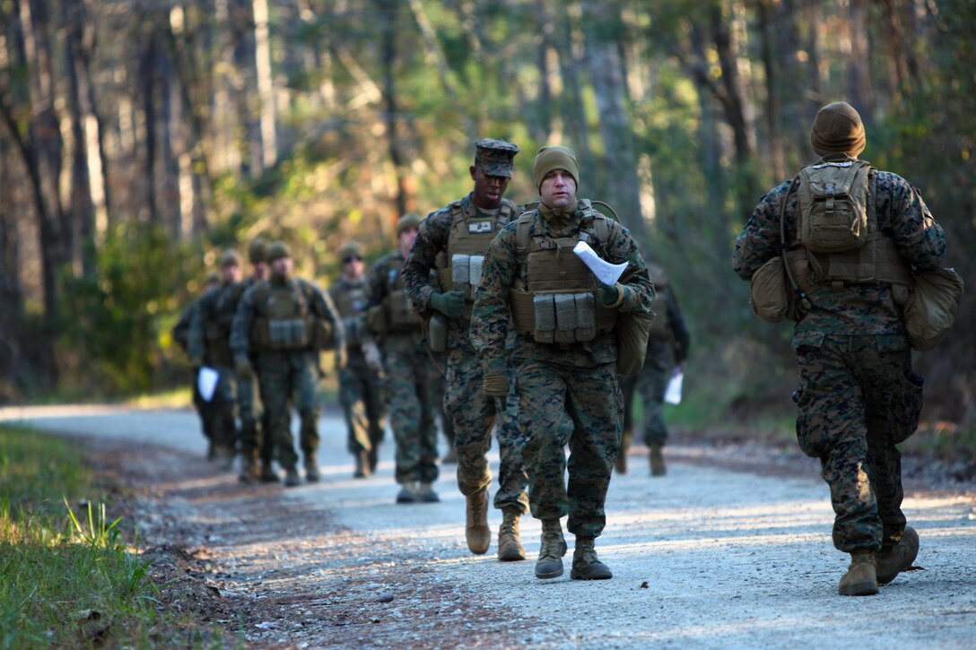 Marines with Marine Wing Support Squadron 274’s Engineer Company, Heavy Equipment Platoon set their pace count before beginning a land navigation course at Marine Corps Air Station Cherry Point, N.C., Jan. 13, 2016. During the 19-point course, 20 Marines headed to the field to re-experience the basic land navigation process. The course was a refresher for most of the Marines, who have not used land navigation since Marine Combat Training. (U.S. Marine Corps photo by Pfc. Nicholas P. Baird/Released)