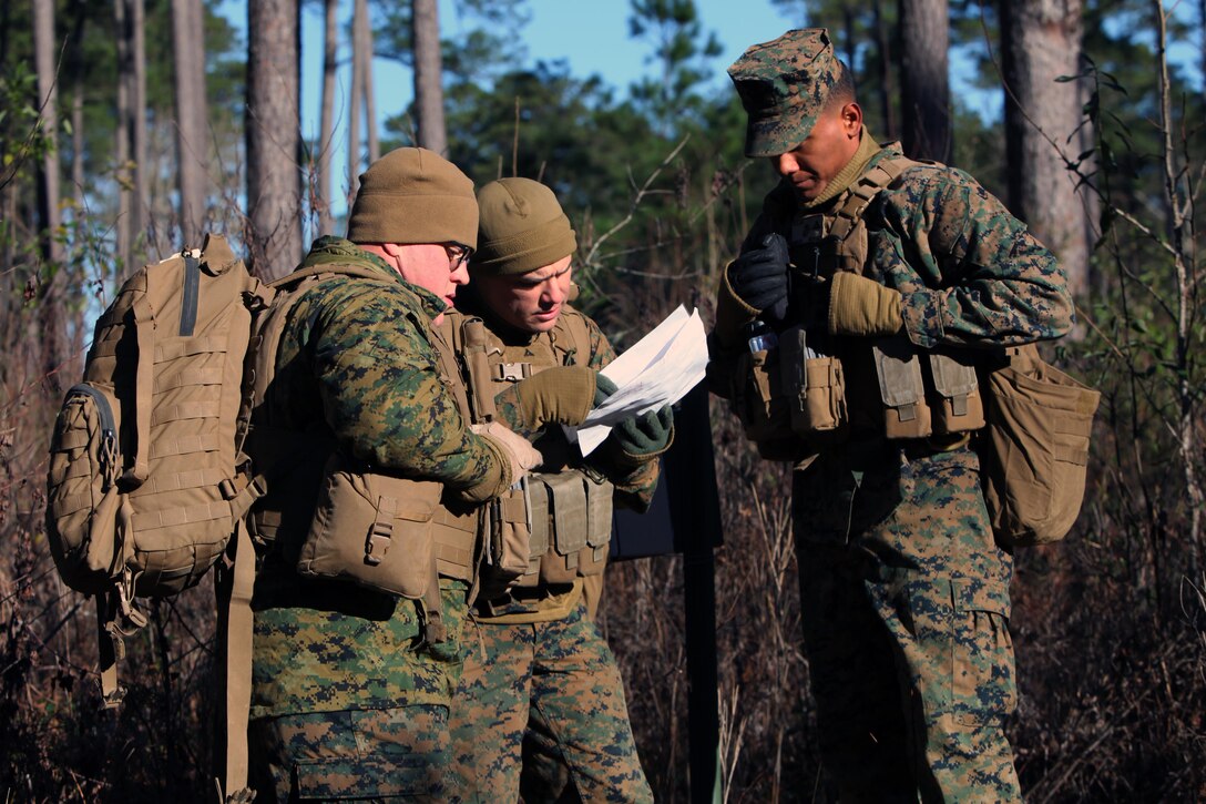 Marines with Marine Wing Support Squadron 274’s Engineer Company, Heavy Equipment Platoon review their map during a land navigation course at Marine Corps Air Station Cherry Point, N.C., Jan. 13, 2016. During the 19-point course, 20 Marines headed to the field to re-experience the basic land navigation process. The course was a refresher for most of the Marines, who have not used land navigation since Marine Combat Training. (U.S. Marine Corps photo by Pfc. Nicholas P. Baird/Released)