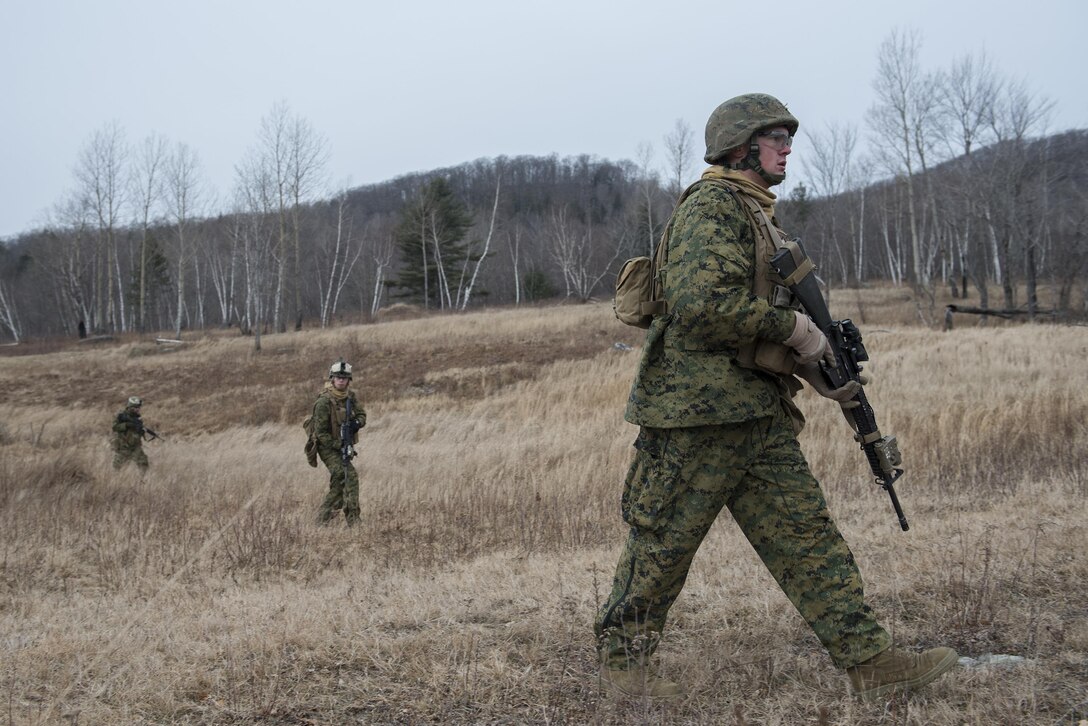Marines move out on Camp Ethan Allen Training Site, Jericho, Vt., Jan. 12, 2016. The Marines are sustaining offensive and defensive core competencies while conducting cold weather training in a mountainous environment. The Marines are assigned to the 4th Marine Division's Charlie Company, 1st Battalion, 25th Marine Regiment, Marine Forces Reserve. Vermont Air National Guard photo by Tech. Sgt. Sarah Mattison