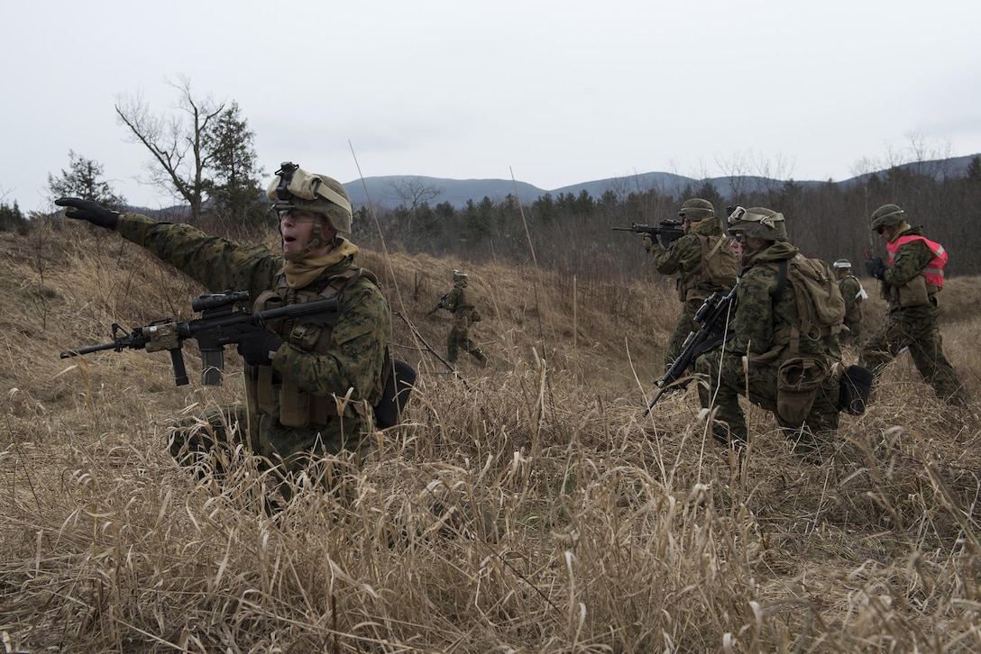 A Marine yells commands for his team members during an assault on Camp Ethan Allen Training Site, Jericho, Vt., Jan. 12, 2016. Vermont Air National Guard photo by Tech. Sgt. Sarah Mattison