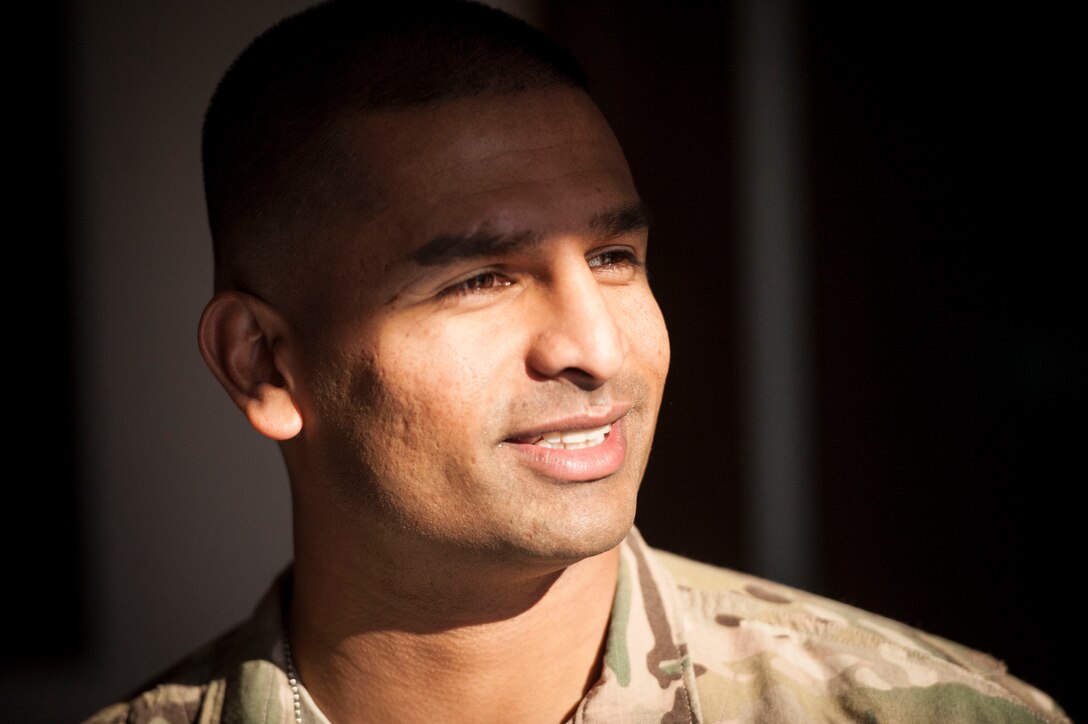 Capt. Jophiel Philips, 27th Special Operations Wing Judge Advocate, greets the attendees of his Bronze Star presentation ceremony Jan. 12, 2016, at Cannon Air Force Base, N.M. Philips was in close proximity to a vehicle-borne blast and despite being wounded, aided his fellow service members in repelling an insurgent attack on Camp Integrity, Afghanistan during a deployment in 2015. (U.S. Air Force photo/Tech. Sgt. Manuel Martinez)