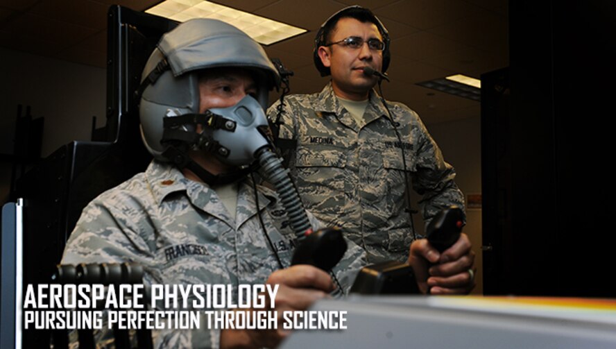 Staff Sgt. Lorenzo Medina, 27th Special Operations Support Squadron operational and aerospace physiology NCO in charge, gives direction as Maj. Francisco Medina, 27th SOSS operational and aerospace physiology chief, undergoes altitude training using the reduced oxygen breathing device Dec. 9, 2015, at Cannon Air Force Base, N.M. One of many facets performed by Air Force aerospace physiologists, the reduced oxygen breathing device is used to familiarize pilots and aircrew with the effects and symptoms of hypoxia. (U.S. Air Force photo/Staff Sgt. Whitney Amstutz)