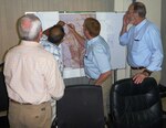 In this photo, USACE debris management subject matter experts work with the Government of Bangladesh to identify potential temporary debris disposal sites for the Dhaka City Debris Management Plan.