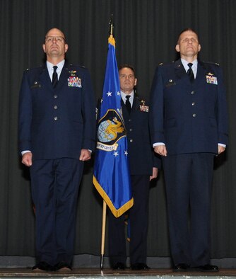 Col. Raymond Kozak, 349th Air Mobility Wing commander and Lt. Col. David Enfield, 349th Mission Support Group commander, stand at attention during the 349 MSG assumption of command ceremony Jan. 9, 2016, at Travis Air Force Base, Calif. (U.S. Air Force photo / Staff Sgt. Christopher Carranza)