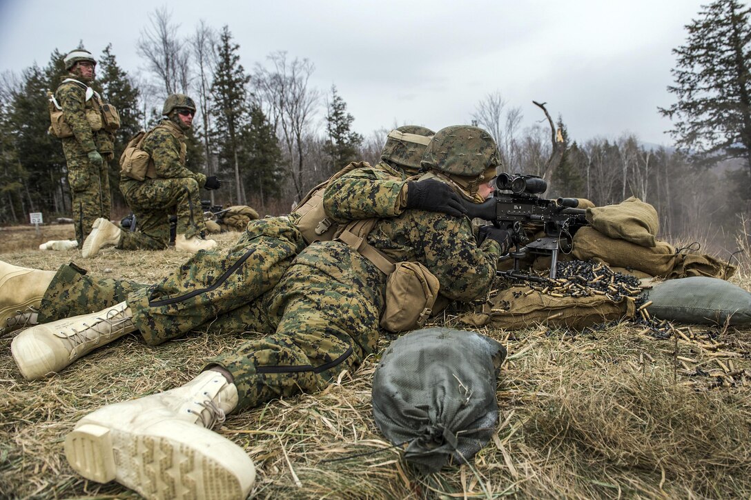Marines fire machine guns at targets as part of an assault exercise on Camp Ethan Allen Training Site in Jericho, Vt., Jan. 12, 2016. Vermont National Guard photo by Air Force Tech. Sgt. Sarah Mattison
