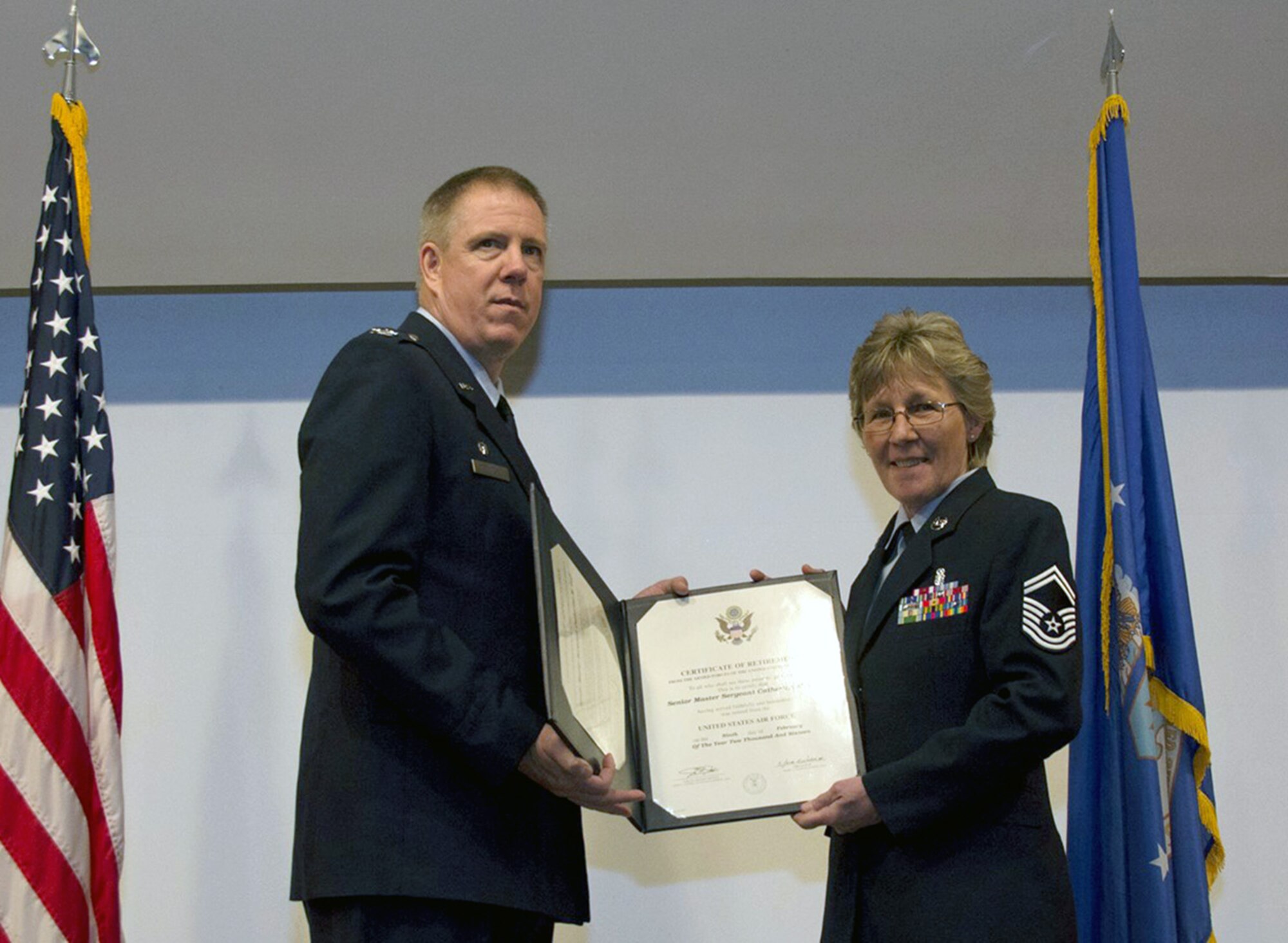 Senior Master Sgt. Catherine Goff, 349th Medical Squadron medical admin specialist, retires after 33 years of service split between the U.S. Air Force Reserve and the U.S. Army during a ceremony Jan. 9, 2016, at Travis Air Force Base, Calif. (U.S. Air Force photo/Airman 1st Class Shelby R. Horn)