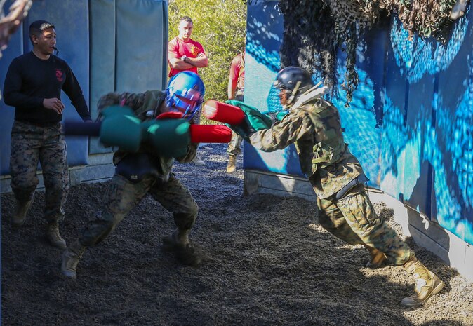 Recruits of Charlie Company, 1st Recruit Training Battalion, spar against each other during the Pugil Sticks III event at Marine Corps Recruit Depot San Diego, Dec. 29. Maintaining balance and using proper technique was critical to the success of the match. Annually, more than 17,000 males recruited from the Western Recruiting Region are trained at MCRD San Diego. Charlie Company is scheduled to graduate Jan. 22.