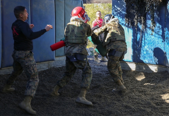 Recruits of Charlie Company, 1st Recruit Training Battalion, spar against each other during the Pugil Sticks III event at Marine Corps Recruit Depot San Diego, Dec. 29. This is one of the few opportunities during recruit training when recruits are allowed and encouraged to use full physical force against another recruit. Pugil Sticks I, II and the Crucible are the only other opportunities. Annually, more than 17,000 males recruited from the Western Recruiting Region are trained at MCRD San Diego. Charlie Company is scheduled to graduate Jan. 22.