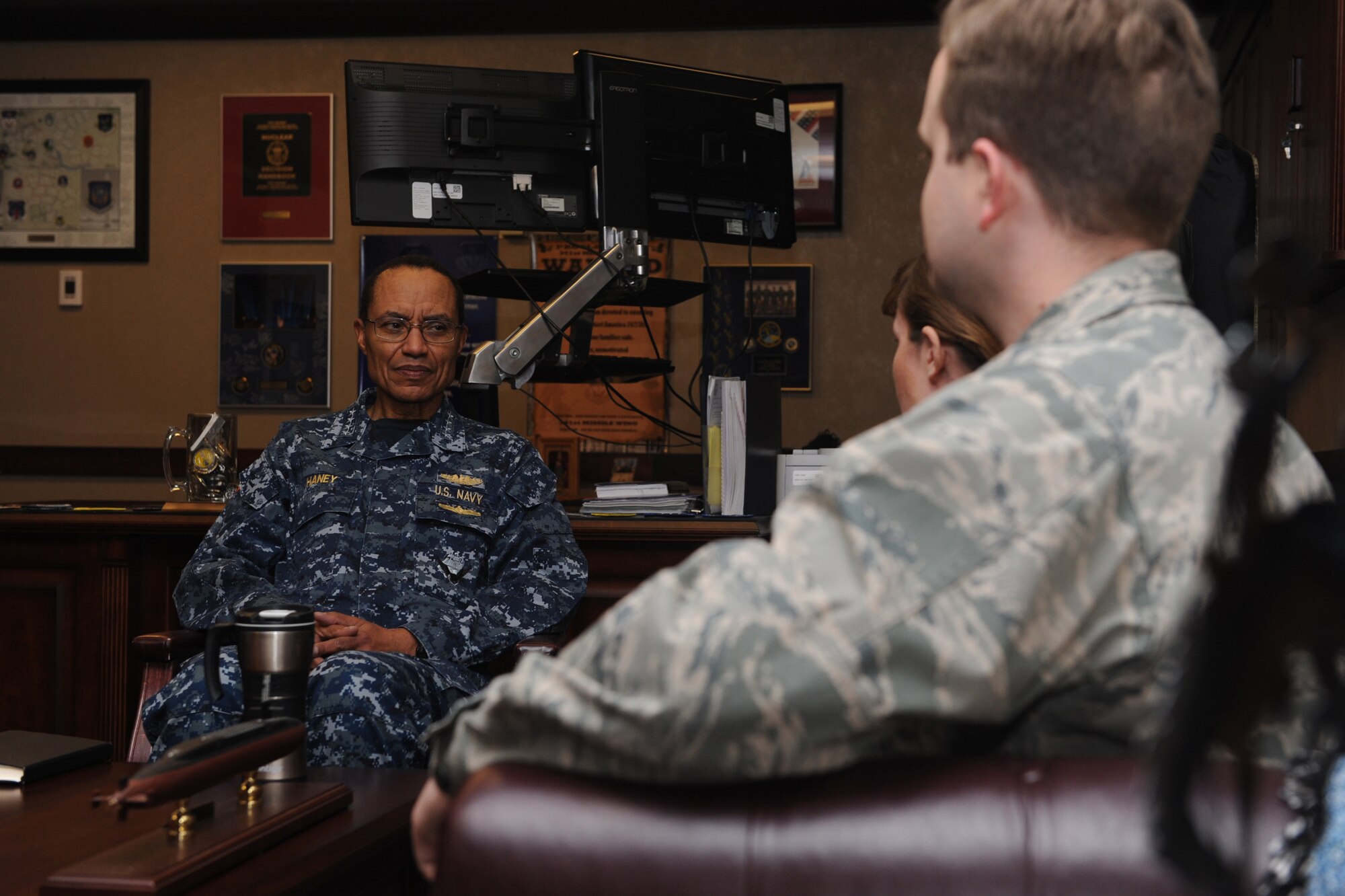 U.S. Navy Adm. Cecil D. Haney, U.S. Strategic Command (USSTRATCOM) commander, speaks with 1st Lt. Laura Carroll, 341st Operation Support Squadron emergency war orders planner, and Capt. Phillip Imhoff, 341st OSS Intercontinental Ballistic Missile scenario developer, about their everyday duties in support of the mission of nuclear deterrence Jan. 14, 2016, at Malmstrom Air Force Base, Mont. During his visit there, Haney had breakfast with Airmen; toured the security forces, missile maintenance and other facilities; and conducted a base-wide all call to discuss USSTRATCOM’s mission areas and priorities and Malmstrom’s vital role in deterrence and assurance. He also thanked the men and women at Malmstrom for their efforts in providing the nation with a safe, secure, effective and ready nuclear deterrent. One of nine DoD unified combatant commands, USSTRATCOM has global strategic missions, assigned through the Unified Command Plan, which include strategic deterrence; space operations; cyberspace operations; joint electronic warfare; global strike; missile defense; intelligence, surveillance and reconnaissance; combating weapons of mass destruction; and analysis and targeting. (U.S. Air Force photo by Airman Daniel Brosam)