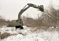 Soldiers with the 770th Engineer Company, 479th Engineer Battalion, 411th Engineer Brigade, 412th Theater Engineer Command, are working to clear land in Mattydale, N.Y., which will become home to a new Army Reserve Center.