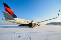 An Airman from the 51st Maintenance Squadron transient alert uses an aircraft de-icer on a government chartered aircraft after a large amount of snowfall at Osan Air Base, Republic of Korea, Jan. 14, 2016.  The de-icing process ensures the safe travel of passengers and cargo.
(U.S. Air Force photo by Airman 1st Class Dillian Bamman/Released)
