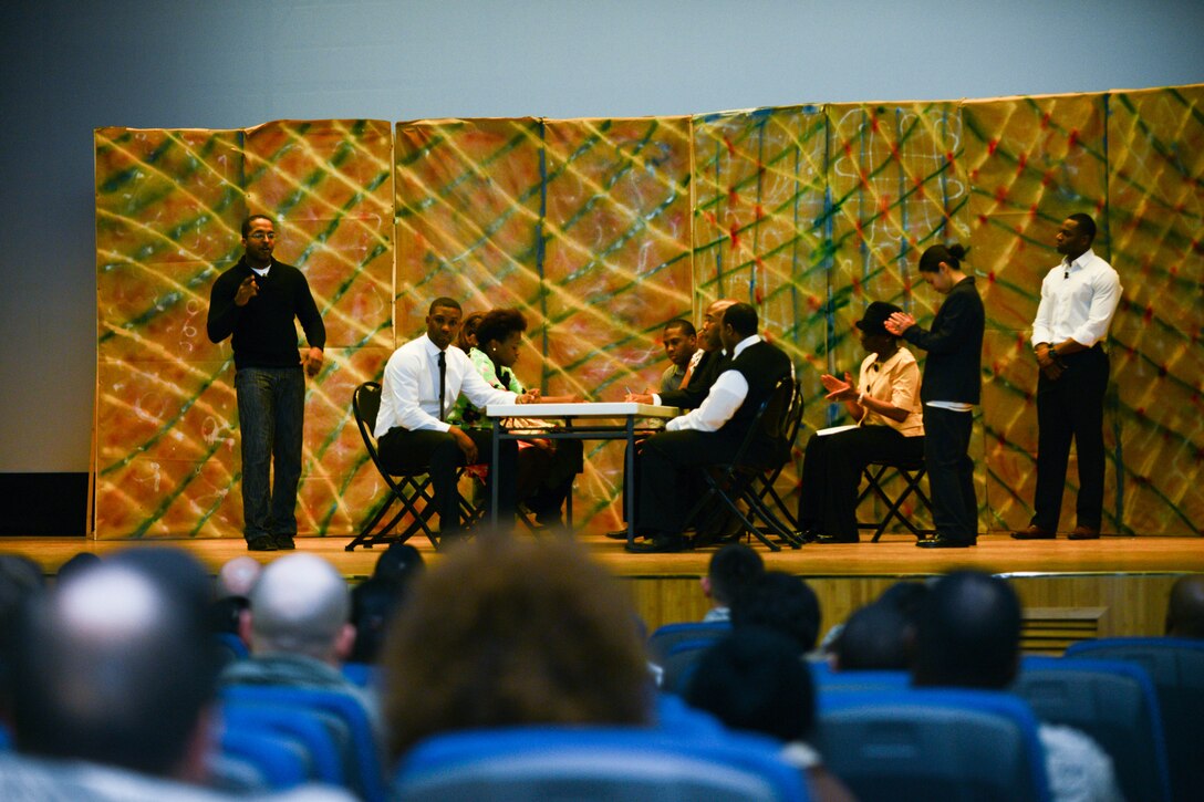 Volunteers of Team Osan perform a play during a Rev. Dr. Martin Luther King Jr. stage reenactment at Osan Air Base, Republic of Korea, Jan. 14, 2016. The actors portrayed events from King’s childhood to his funeral. (U.S. Air Force photo by Airman 1st Class Dillian Bamman/Released)