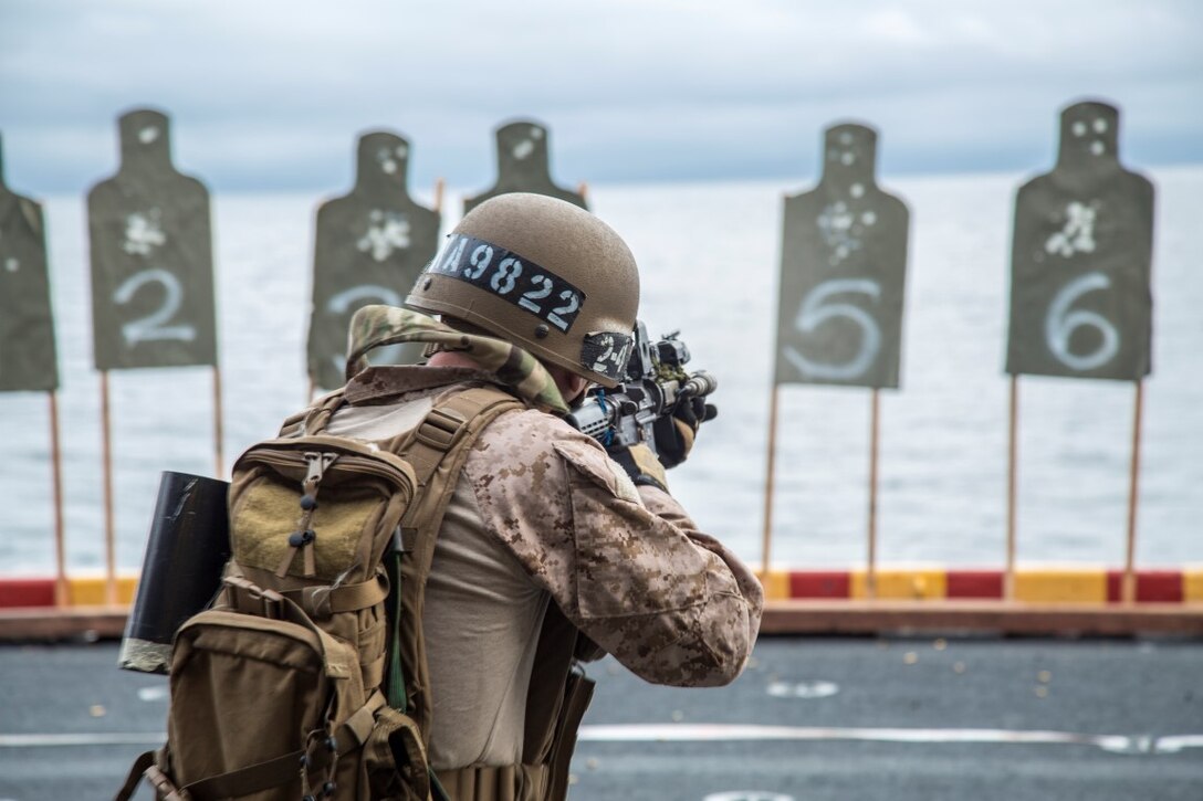 A U.S. Marine with Maritime Raid Force, 13th Marine Expeditionary Unit, conducts a deck shoot during Sustainment Exercise aboard the USS Boxer, January 18, 2016. SUSTEX is designed to reinforce and refine the Boxer Amphibious Ready Group/MEU's execution of mission essential tasks in preparation for their upcoming deployment. (U.S. Marine Corps photo by Sgt. Hector de Jesus/Released)