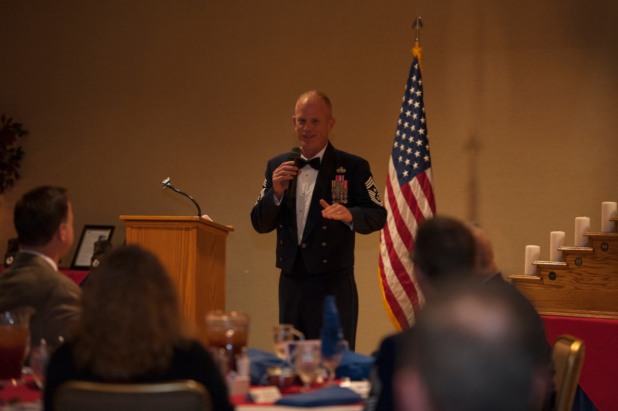 U.S. Air Force Chief Master Sgt. Frank H. Batten III, Ninth Air Force command chief, speaks during the Chief Recognition Ceremony, Jan. 16, 2016 at Moody Air Force Base, Ga. Batten spoke about how far the new chief master sergeant selects have come joining the top one percent of the enlisted force and the importance their leadership will have on the other 99 percent. (U.S. Air Force photo by Airman 1st Class Kathleen D. Bryant/Released)

