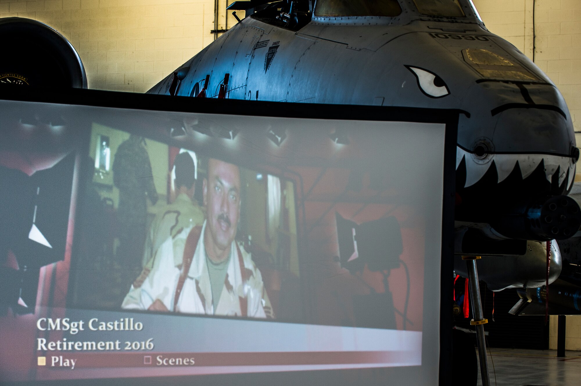 A powerpoint displays highlights of the career of U.S. Air Force Chief Master Sgt. Guillermo Castillo, 23d Maintenance Group wing weapons manager, during Castillo’s retirement ceremony, Jan. 15, 2016, at Moody Air Force Base, Ga. Castillo, a Texas native, began his Air Force career at Lackland Air Force Base, Texas, and later attended technical training at Lowry AFB, Colo., to be trained as an armament specialist. (U.S. Air Force photo by Senior Airman Ceaira Tinsley/Released)