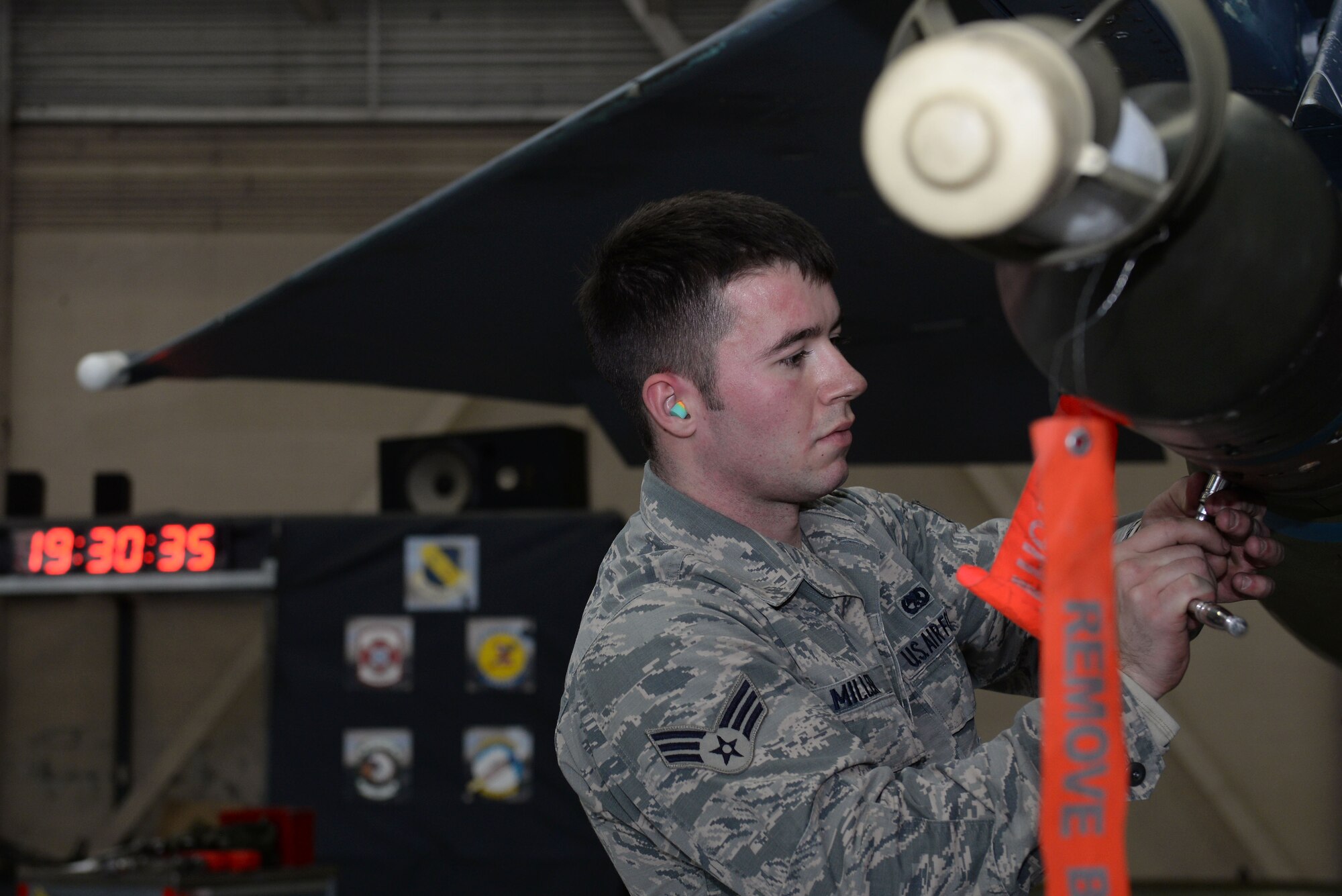 Senior Airman Aaron Miller, 4th Aircraft Maintenance Squadron weapons load technician, races against the clock to secure a munition on an F-15E Strike Eagle during a Load Crew of the Year competition, Jan. 15, 2016, at Seymour Johnson Air Force Base, North Carolina. Airmen competed against other load crew teams for the best mission completion time while ensuring accuracy, serviceability and efficiency. (U.S. Air Force photo/Senior Airman John Nieves Camacho)