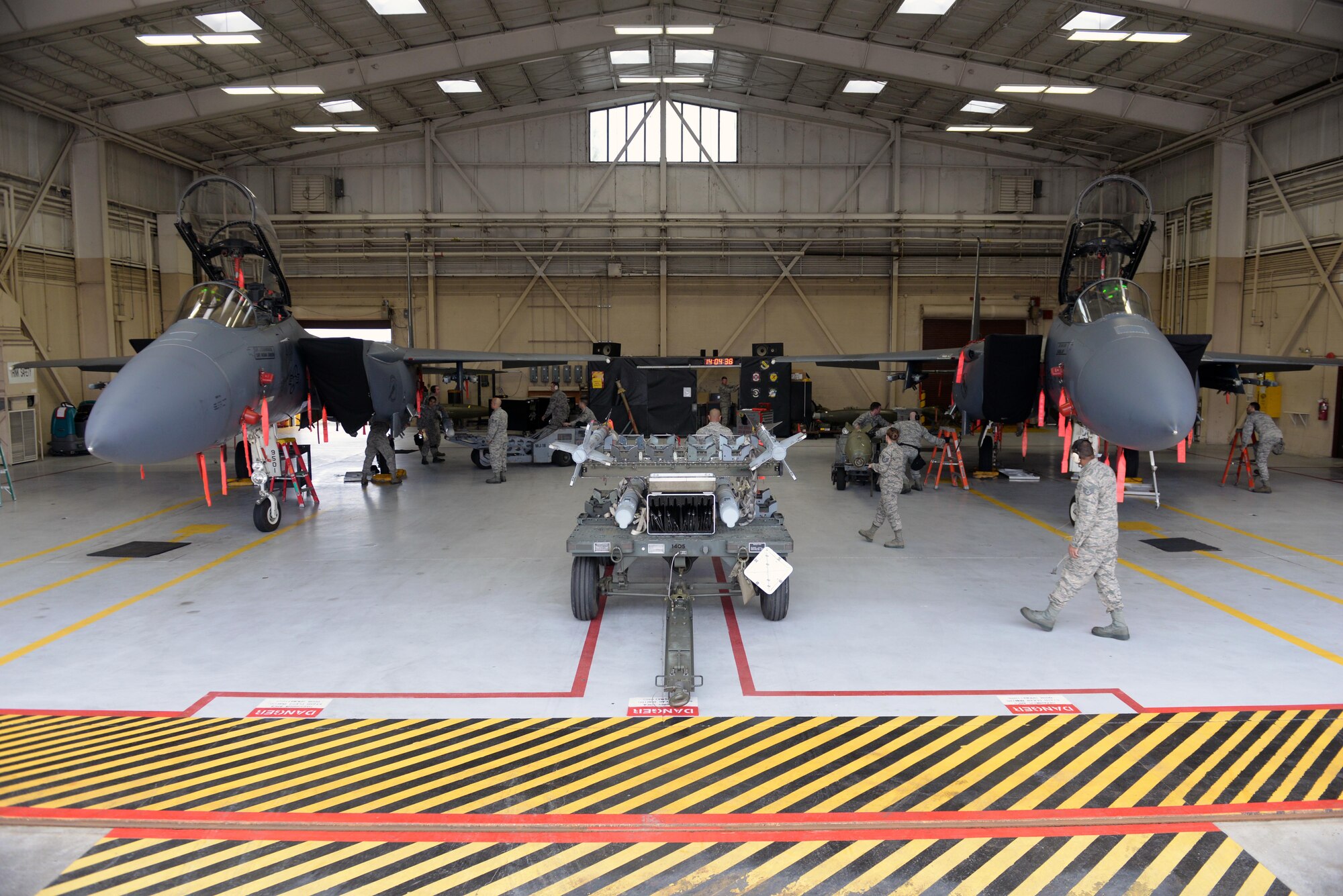 Airmen assigned to the 4th Aircraft Maintenance Squadron participate in the Load Crew of the Year competition, Jan. 15, 2016, at Seymour Johnson Air Force Base, North Carolina. Airmen represented their respective aircraft maintenance units and raced against the clock to quickly and efficiently load pre-designated munitions onto F-15E Strike Eagles. (U.S. Air Force photo/Senior Airman John Nieves Camacho)