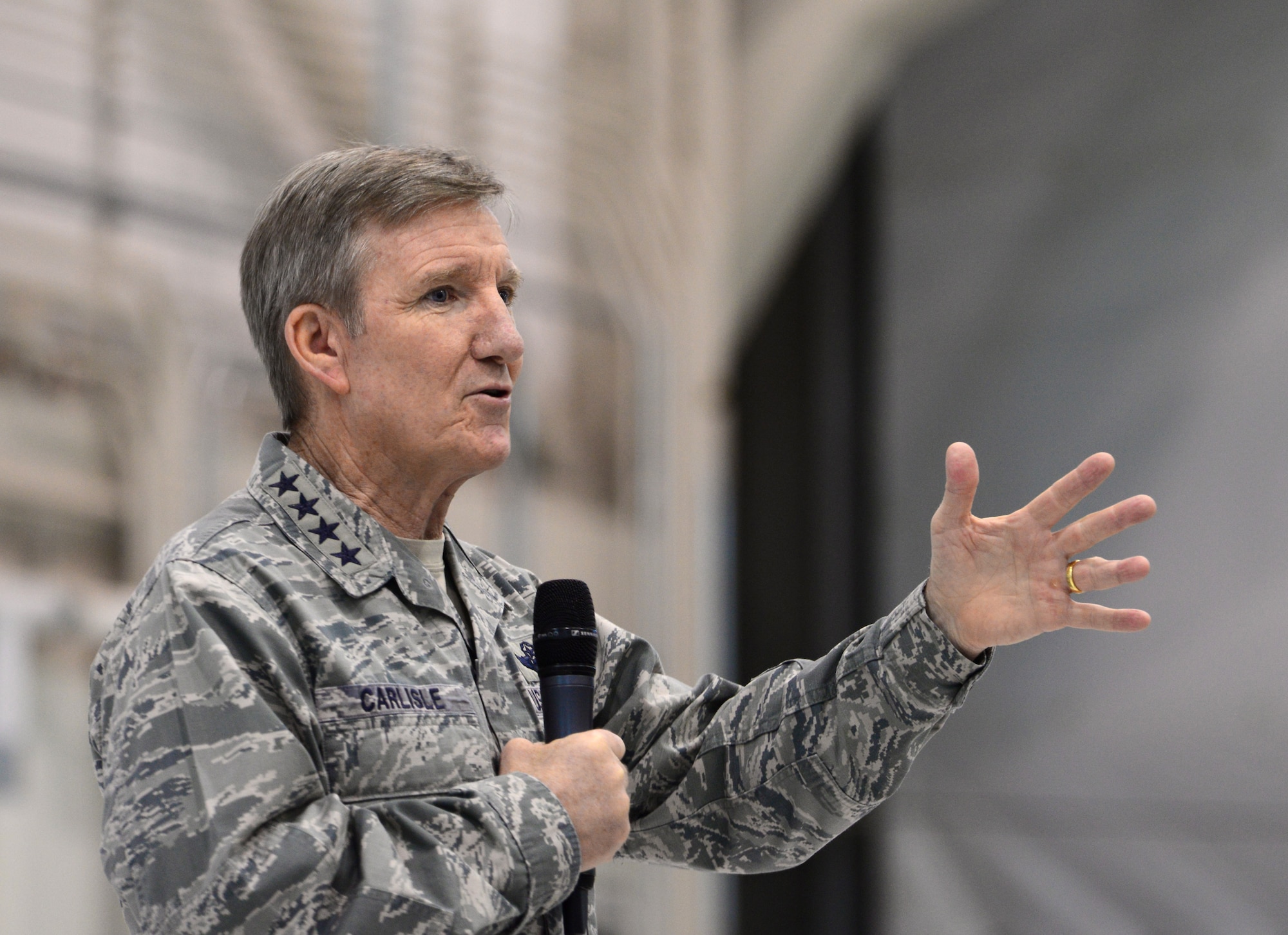Gen. Hawk Carlisle, commander of Air Combat Command, briefs Airmen of the 432nd Wing/432nd Air Expeditionary Wing Jan. 14, 2016, during his visit to Creech Air Force Base, Nevada. During the all-call, Carlisle recapped the findings of the Culture and Process Improvement Program, an initiative which studied challenges within the remotely piloted aircraft enterprise. He also explained the measures the Air Force is taking to alleviate the problems. (U.S. Air Force photo by Senior Airman Christian Clausen/Released)