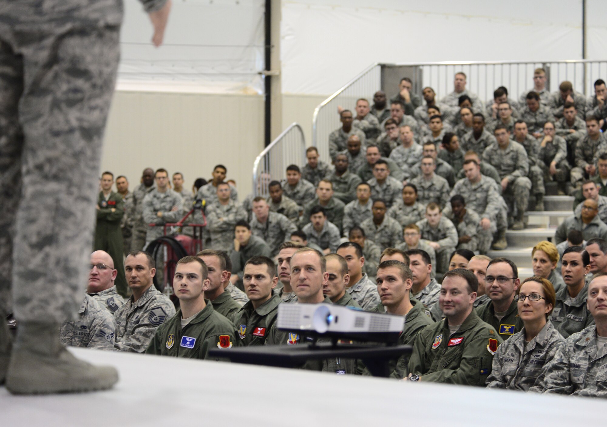Airmen from the 432nd Wing/432nd Air Expeditionary Wing listen to Gen. Hawk Carlisle, commander of Air Combat Command, speak during an all-call Jan. 14, 2016, as part of his visit to Creech Air Force Base, Nevada. Carlisle spoke about issues related to the remotely piloted aircraft community during the all-call. (U.S. Air Force photo by Senior Airman Christian Clausen/Released)