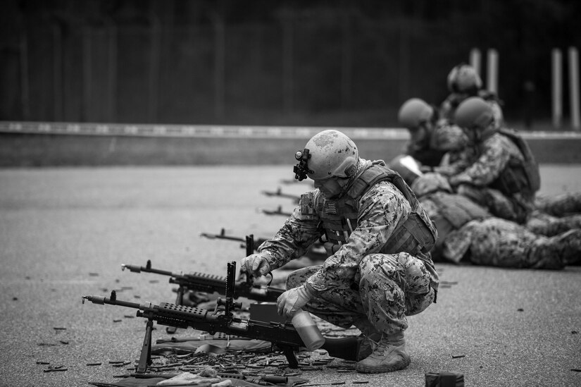 A sailor ensures a M240 Bravo machine gun is lubricated during weapons sustainment training Jan. 9, 2016 at Joint Base Charleston, S.C. The two day, semi-annual training event was hosted by the Coastal Riverine Squadron 10 Bravo Company, a Navy Reserve team stationed at Joint Base Charleston – Weapons Station. The participants were required to show proficiency and familiarization with the M240B machine gun. (U.S Air Force Photo/Staff Sgt. Jared Trimarchi)