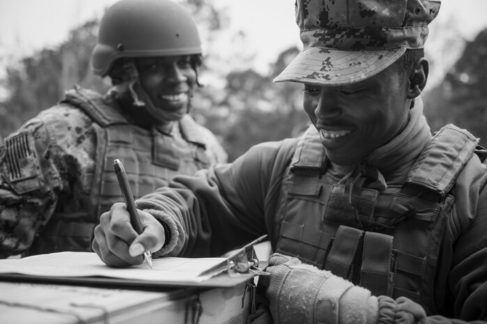 Sailors participating in weapons sustainment training sign in to ensure full credit for the course Jan. 9, 2016, at Joint Base Charleston, S.C. The two day, semi-annual training event was hosted by the Coastal Riverine Squadron 10 Bravo Company, a Navy Reserve team stationed at Joint Base Charleston – Weapons Station. The participants were required to show proficiency and familiarization with the M240B machine gun. (U.S Air Force Photo/Staff Sgt. Jared Trimarchi)