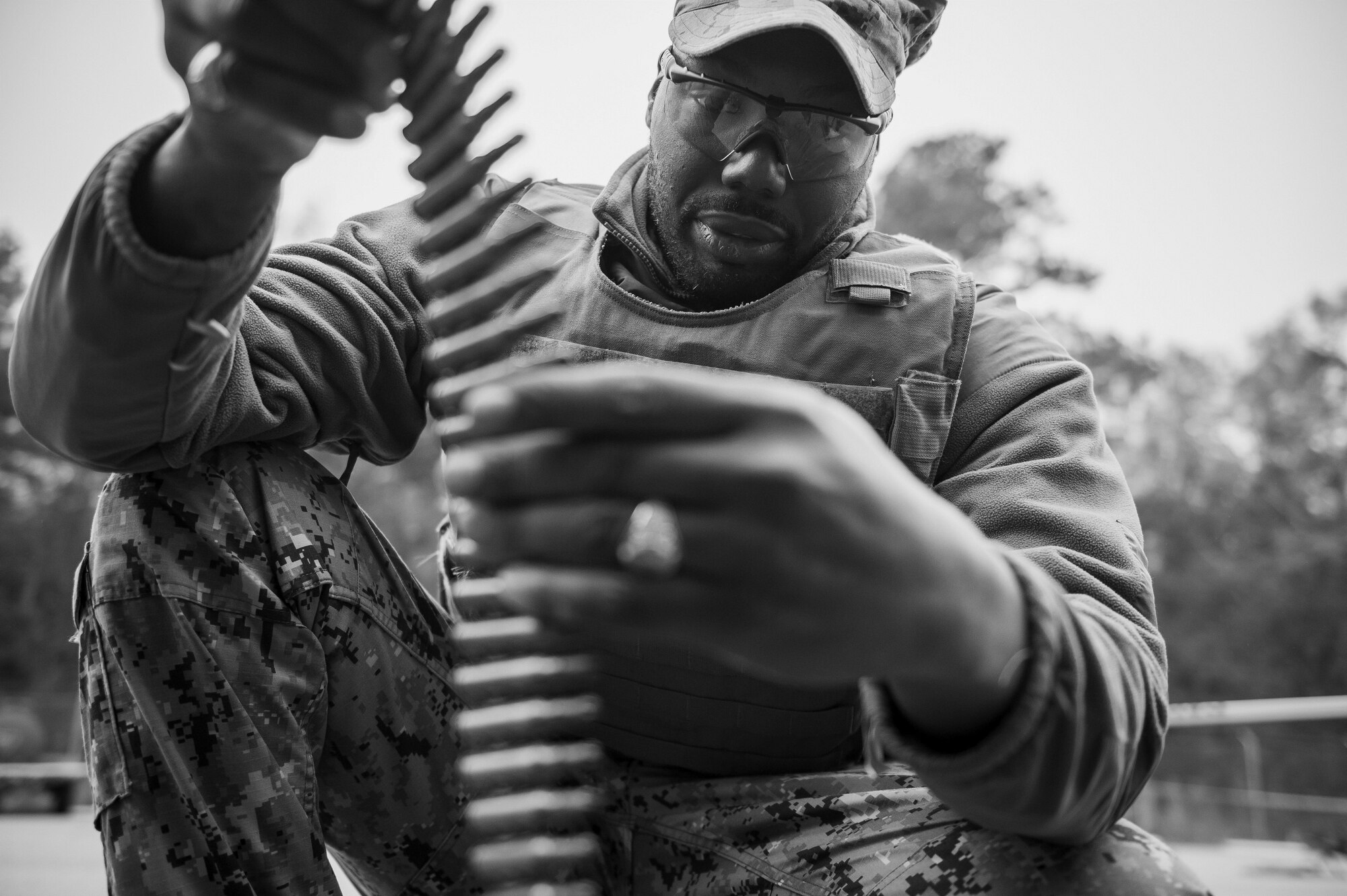 Master at Arms 2nd Class Winston Hardison counts 7.62mm rounds during weapons sustainment training Jan. 9, 2016, at Joint Base Charleston, S.C. The two day, semi-annual training event was hosted by the Coastal Riverine Squadron 10 Bravo Company, a Navy Reserve team stationed at Joint Base Charleston – Weapons Station. The participants were required to show proficiency and familiarization with the M240B machine gun. (U.S Air Force Photo/Staff Sgt. Jared Trimarchi)
