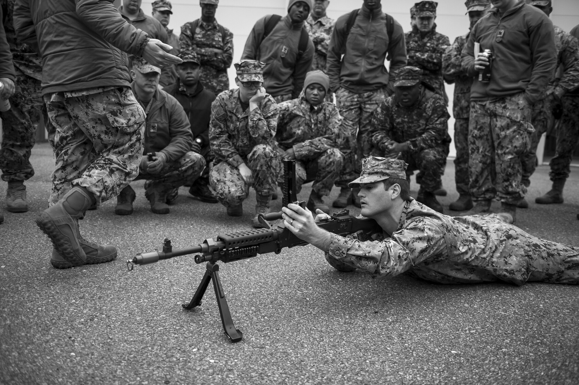 Master at Arms 1st Class Chase Ferguson shows basic weapon handling procedures to participants of weapons sustainment training Jan. 9, 2016, at Joint Base Charleston, S.C. The two day, semi-annual training event was hosted by the Coastal Riverine Squadron 10 Bravo Company, a Navy Reserve team stationed at Joint Base Charleston – Weapons Station. The participants were required to show proficiency and familiarization with the M240B machine gun. (U.S Air Force Photo/Staff Sgt. Jared Trimarchi)