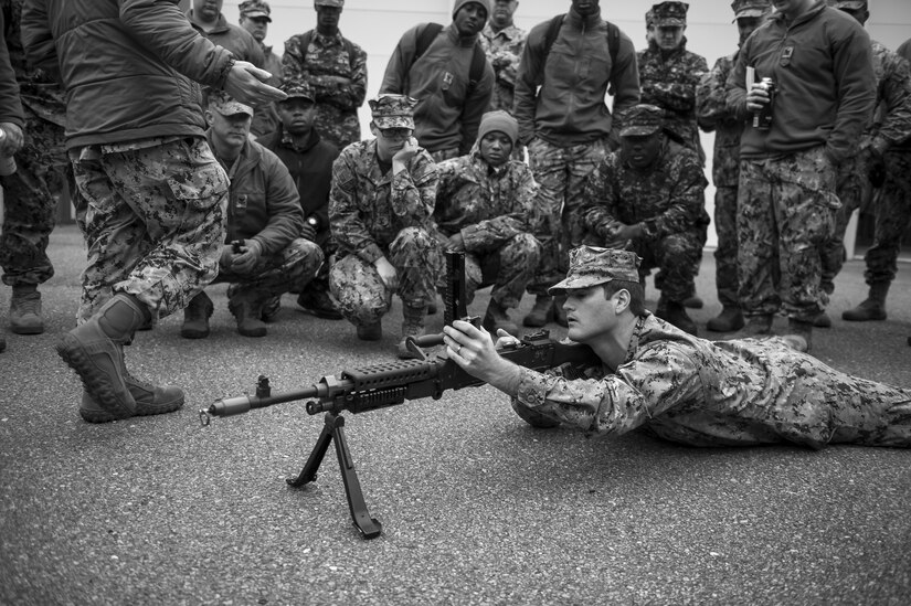 Master at Arms 1st Class Chase Ferguson shows basic weapon handling procedures to participants of weapons sustainment training Jan. 9, 2016, at Joint Base Charleston, S.C. The two day, semi-annual training event was hosted by the Coastal Riverine Squadron 10 Bravo Company, a Navy Reserve team stationed at Joint Base Charleston – Weapons Station. The participants were required to show proficiency and familiarization with the M240B machine gun. (U.S Air Force Photo/Staff Sgt. Jared Trimarchi)