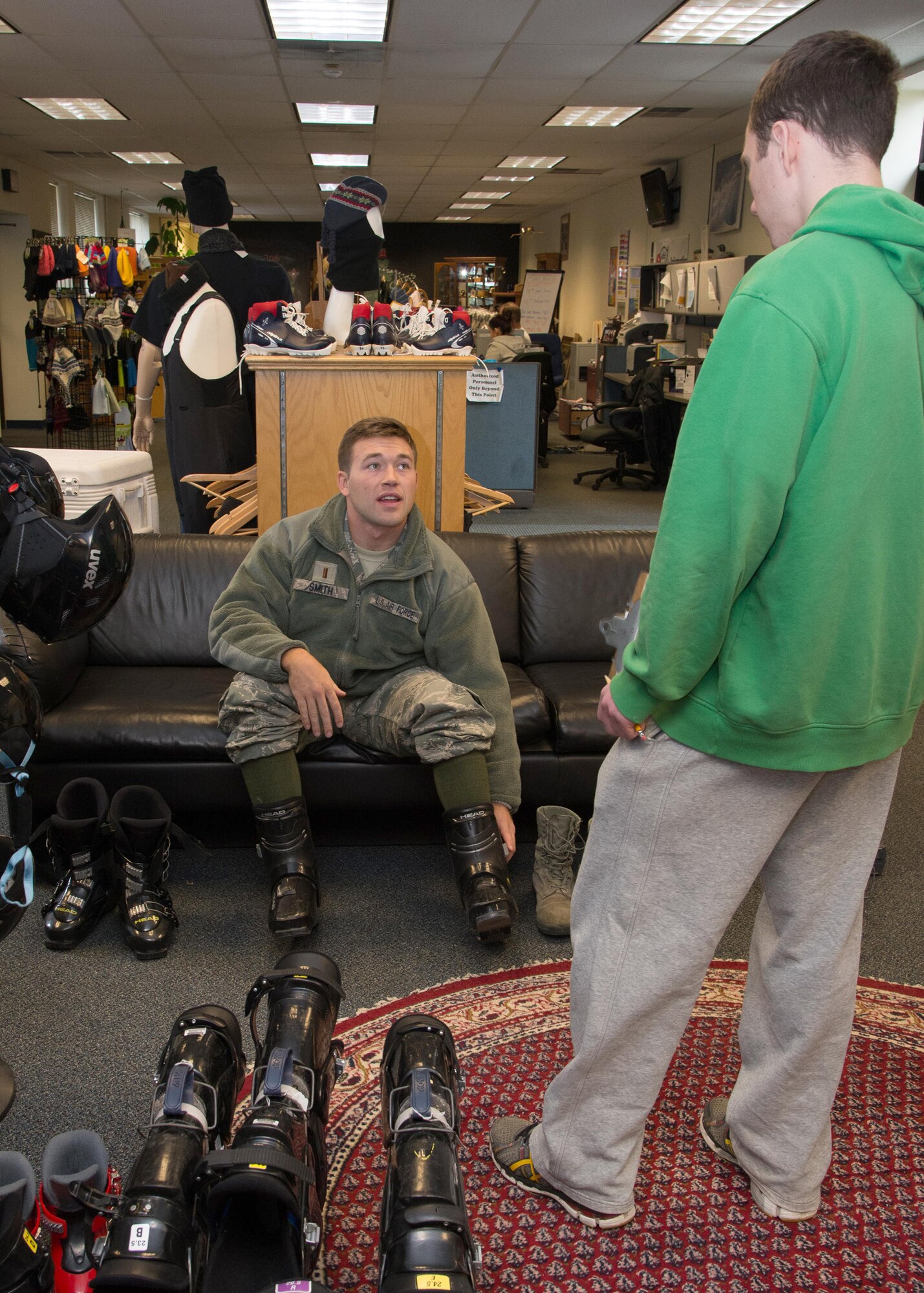 Jim Buckley, 66th Force Support Squadron Outdoor Recreation specialist, assists 2nd Lt. Erik Smith, C3I and Networks program manager, with ski equipment at Outdoor Recreation Jan. 15. Skis, snowboards, cross country skis, ice skates and more are available to rent at Outdoor Recreation. A fitting is required for those in interested in renting skis or snowboards. Fittings must be done in person. For further information, contact Outdoors Recreation at 781-225-6621.(U.S. Air Force photo by Mark Herlihy)