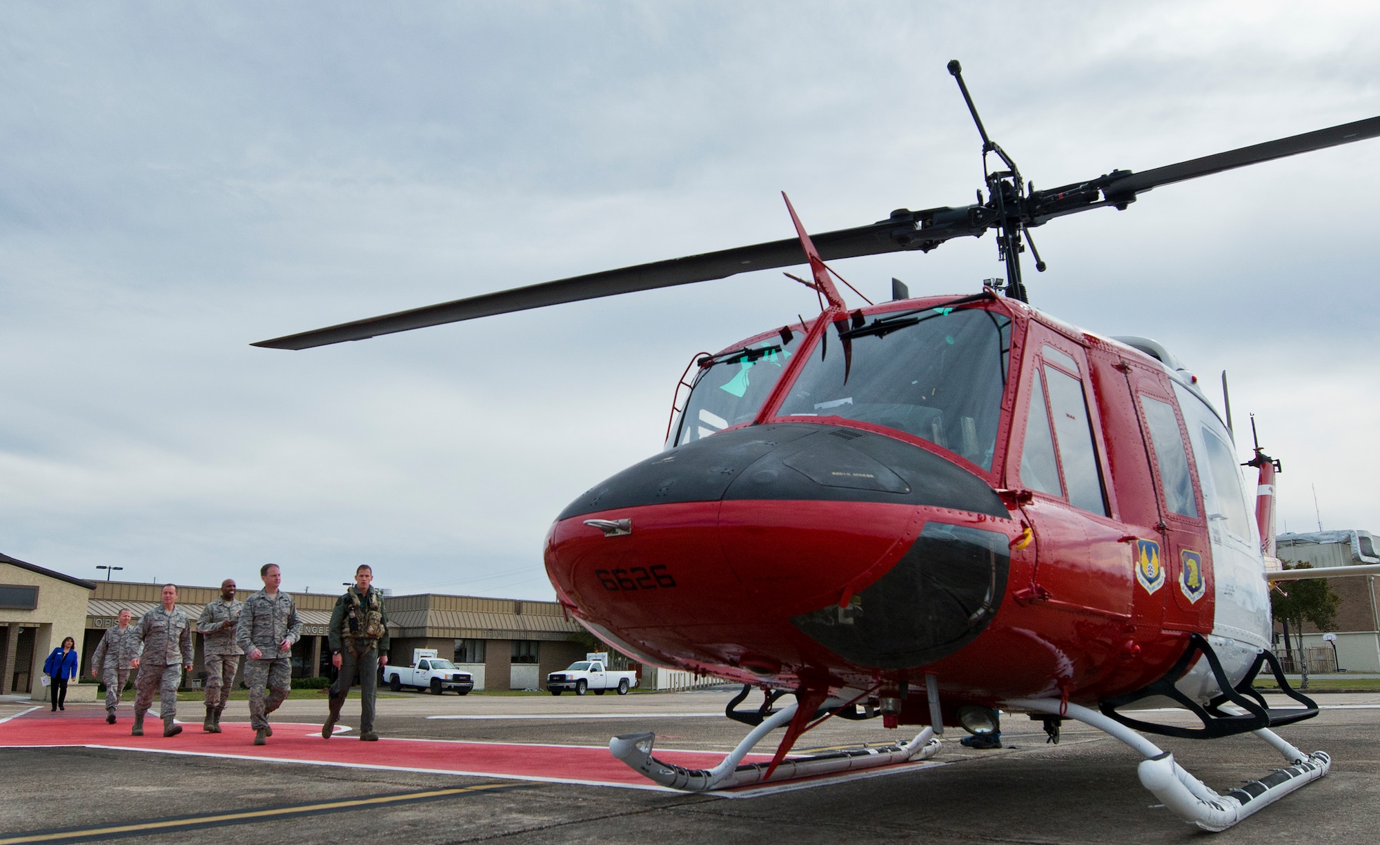 The Commander-In-Chief’s Installation Excellence Award evaluation team walks out to a UH-1 Huey to begin their range and tenant unit tour Jan. 14 at Eglin Air Force Base, Fla.  The evaluators were introduced to the base and visited its various tenant units spread throughout Eglin’s vast range space on the first of their two-day visit.  (U.S. Air Force photo/Samuel King Jr.)