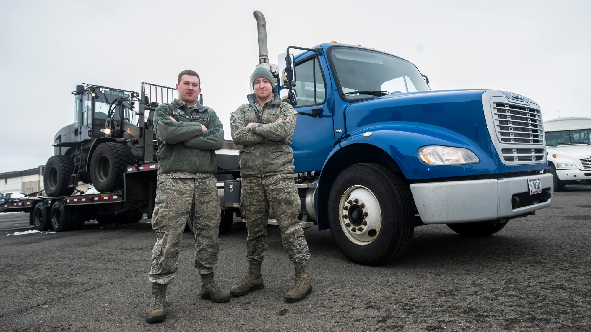 Airman 1st Class Auston R. Reeves and Airman Tucker Gerdes, both 92nd Logistics Readiness Squadron, vehicle operations journeyman, pose for a photo Jan. 10, 2015, at Fairchild Air Force Base, Wash Being in vehicle operations Reeves completes a variety of tasks including transporting flight crew, cargo and conducting wrecker runs. (U.S. Air Force photo/Airman 1st Class Sean Campbell)