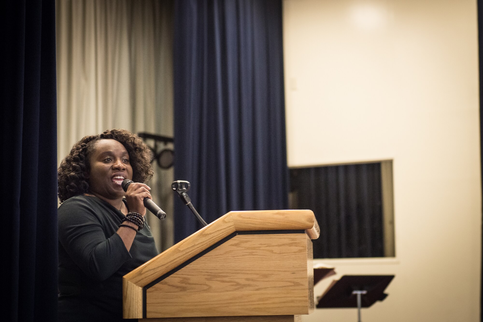 Dr. Kitara Jordan, Joan K. Mendel Elementary teacher, gives a speech at the Martin Luther King Jr. Luncheon on Yokota Air Base, Japan, Jan. 14, 2015. Jordan discussed the progress civil rights has made from the work of MLK Jr. and her hopes for the future. (U.S. Air Force photo by Staff Sgt. Michael Smith/Released)