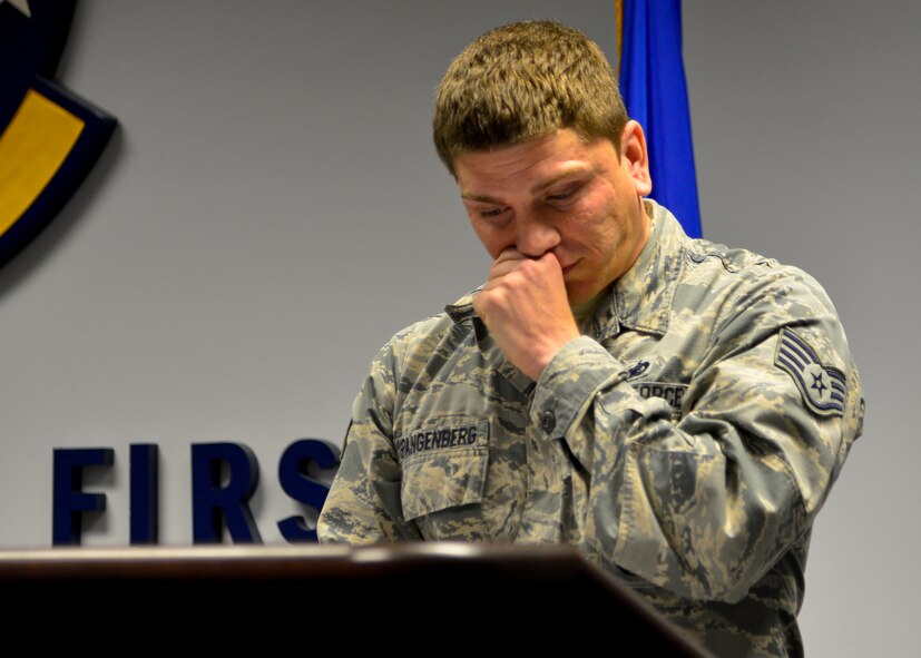 Staff Sgt. Jason Spangenberg, 436th Security Forces Squadron military working dog trainer, chokes up during a speech at MWD Rico/M137’s retirement ceremony Jan. 15, 2016, at Dover Air Force Base, Del. Spangenberg and Rico earned the Army Combat Infantry Badge, Air Force Combat Action Badge and a Bronze Star while deployed to Village Stability Platform Tash Guzar, Afghanistan, in support of Operation Enduring Freedom. (U.S. Air Force photo/Senior Airman William Johnson)