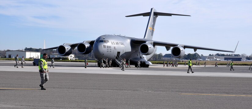 Airmen with the 437th Airlift Wing perform a weekly foreign object debris (FOD) search of the flight line at Joint Base Charleston - Air Base, S.C., Jan 14, 2016. Regular FOD walks on the taxiways and apron help prevent potential damage to the aircraft engines. (U.S. Air Force photo/Tech. Sgt Paul Polaski)
