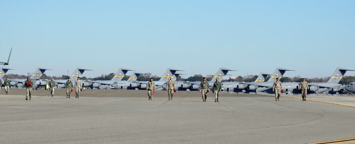 Airmen with the 437th Airlift Wing perform a weekly foreign object debris (FOD) search of the flight line at Joint Base Charleston - Air Base, S.C., Jan 14, 2016. Regular FOD walks on the taxiways and apron help prevent potential damage to the aircraft engines. (U.S. Air Force photo/Tech. Sgt Paul Polaski)

