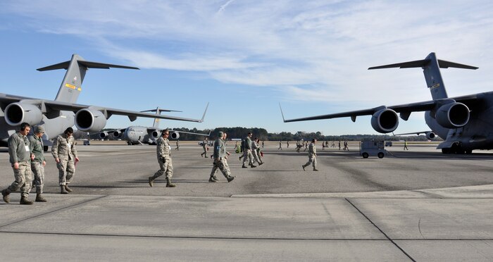 Airmen with the 437th Airlift Wing perform a weekly foreign object debris (FOD) search of the flight line at Joint Base Charleston - Air Base, S.C., Jan 14, 2016. Regular FOD walks on the taxiways and apron help prevent potential damage to the aircraft engines. (U.S. Air Force photo/Tech. Sgt. Paul Polaski)
