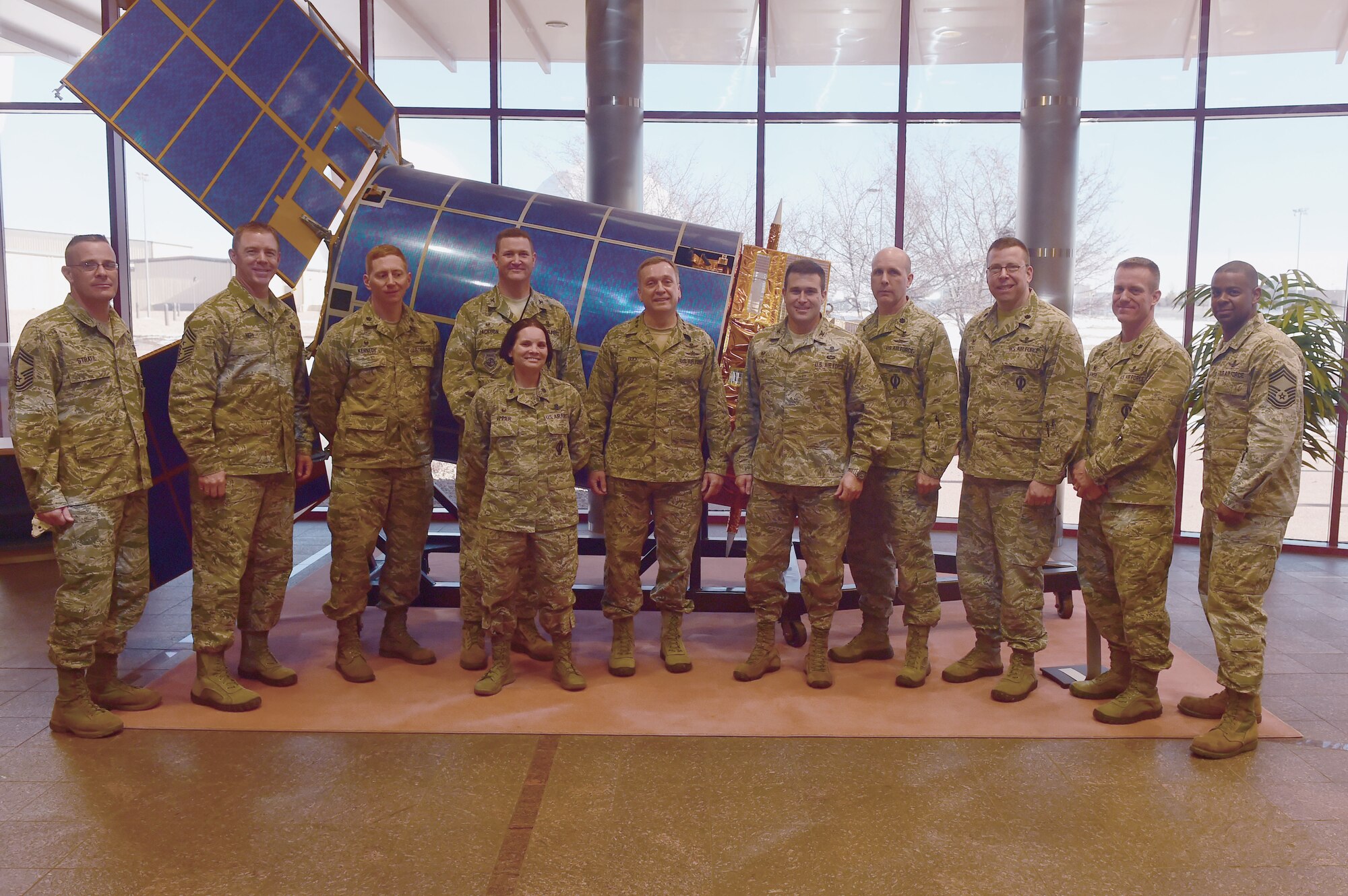 Lt. Gen. David J. Buck, Commander, 14th Air Force (Air Forces Strategic), Air Force Space Command; and Commander, Joint Functional Component Command for Space, U.S. Strategic Command, and other members of AF Space Command pose with 460th Space Wing leadership base Jan. 14, 2016, at Buckley Air Force Base, Colo. Buck visited base facilities and met with members of Team Buckley to discuss the 460th Space Wing mission. (U.S. Air Force photo by Airman 1st Class Luke W. Nowakowski/Released))