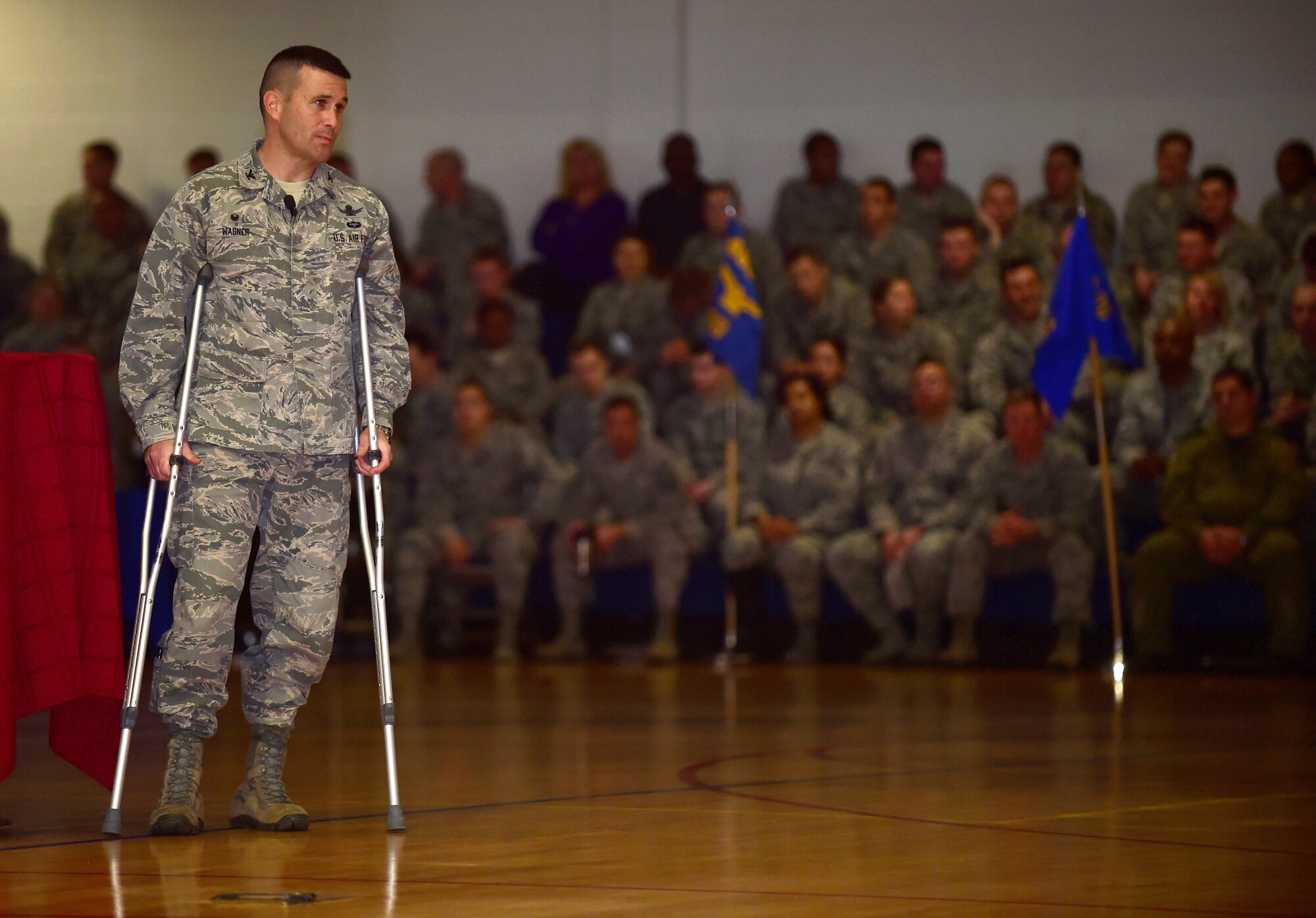 Col. John Wagner, 460th Space Wing commander, speaks about resiliency with members of Team Buckley during a commander’s call Jan. 4, 2016, at the Buckley Fitness Center on Buckley Air Force Base, Colo. Commander’s calls are an easy way for important information to be spread to the people on Buckley AFB. (Photo by Airman 1st Class Gabrielle Spradling/Released)