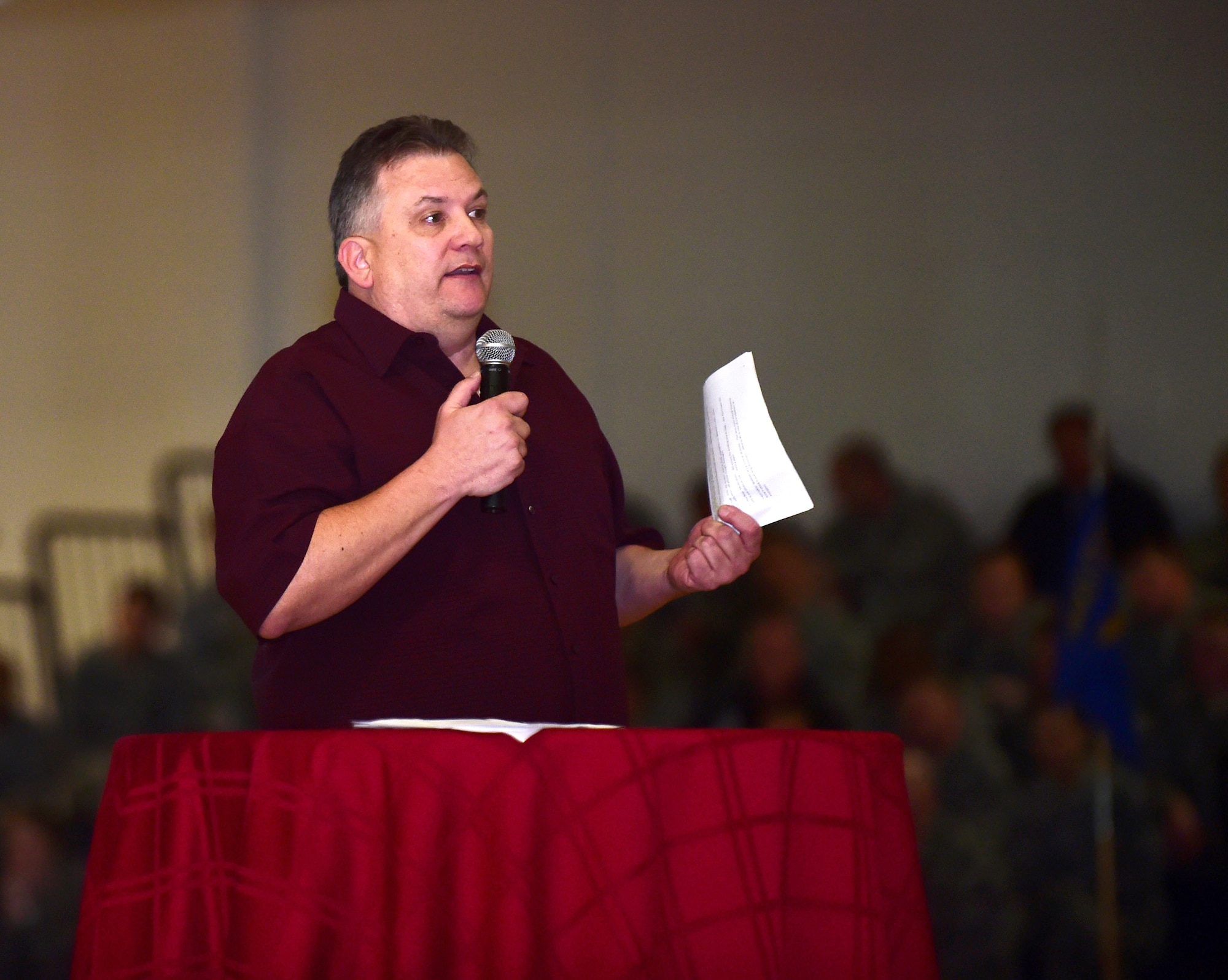 Chris Smith, 460th Space Wing safety office, discusses the new Colorado law, Code 15, during a commander’s call Jan. 4, 2016, at the Buckley Fitness Center on Buckley Air Force Base, Colo. Commander’s calls are an easy way for important information to be spread to the people on Buckley AFB. (Photo by Airman 1st Class Gabrielle Spradling/Released) 