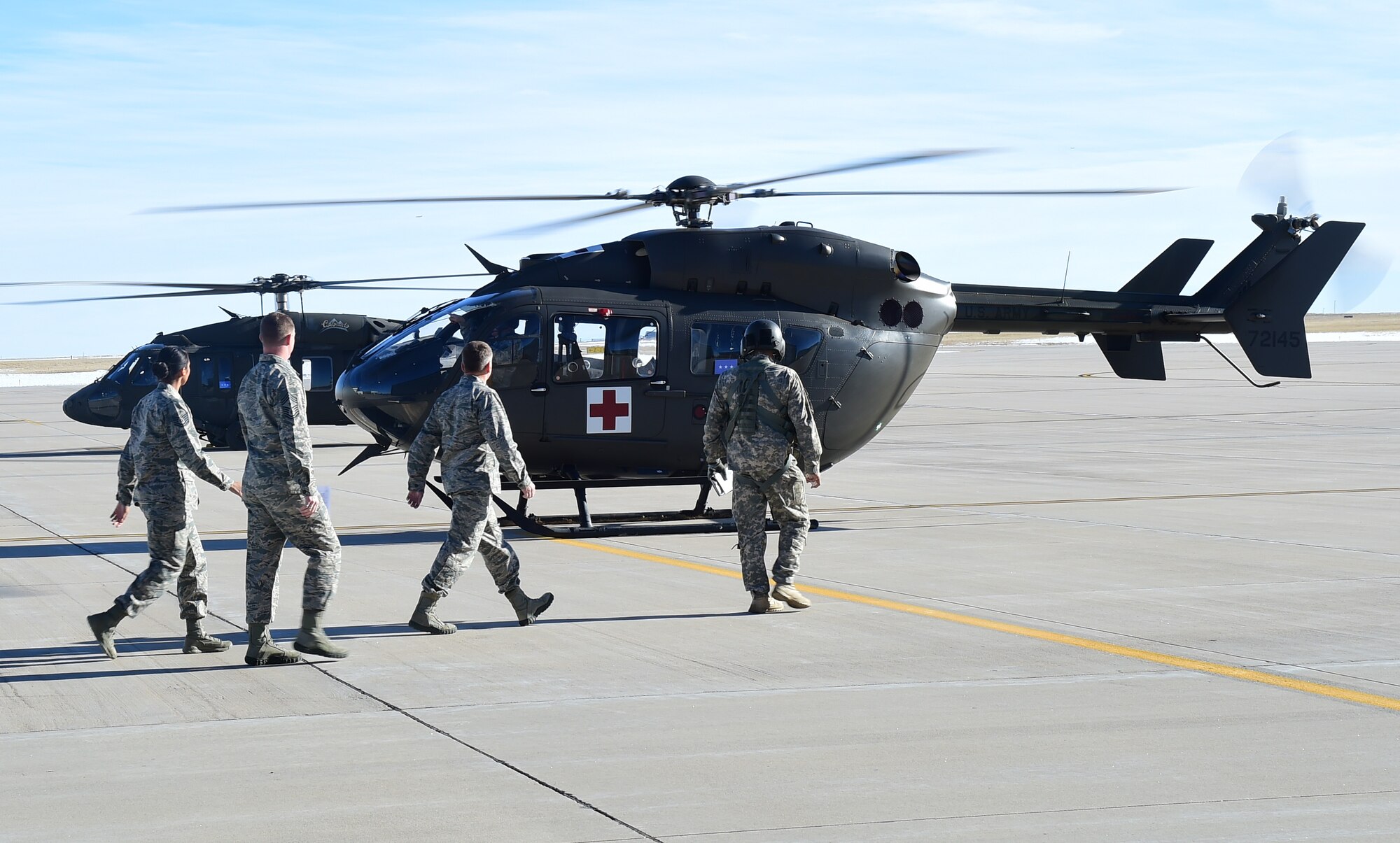 Lt. Gen. David J. Buck, Commander, 14th Air Force (Air Forces Strategic), Air Force Space Command; and Commander, Joint Functional Component Command for Space, U.S. Strategic Command, walks to a helicopter at the Army Aviation Support Facility Jan. 14, 2016, at Buckley Air Force Base, Colo. Buck visited base facilities and met with members of Team Buckley to discuss the 460th Space Wing mission. (U.S. Air Force photo by Airman 1st Class Gabrielle Spradling)