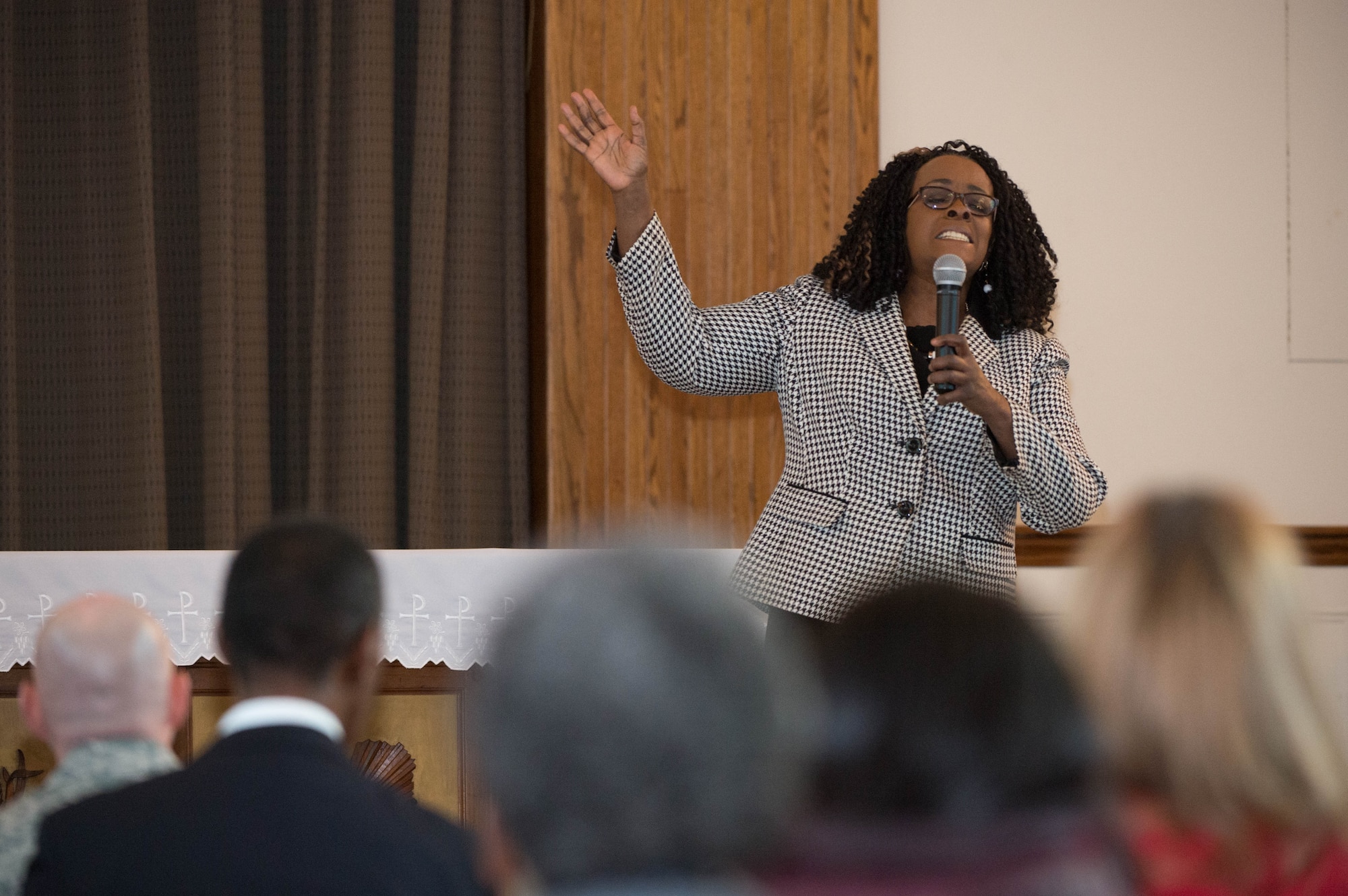 Dr. Juliette Brown sings “Total Praise” during a celebration to remember the life of Dr. Martin Luther King, Jr. at the base chapel Jan. 15. Martin Luther King, Jr. Day, celebrated on the third Monday of January each year, marks the birthday of the civil rights leader. A bill to establish the holiday successfully passed through both houses of Congress in 1983, and President Ronald Reagan signed it into law on Nov. 20 of that year. The first Martin Luther King, Jr. Day was celebrated in 1986. (U.S. Air Force photo by Jerry Saslav)