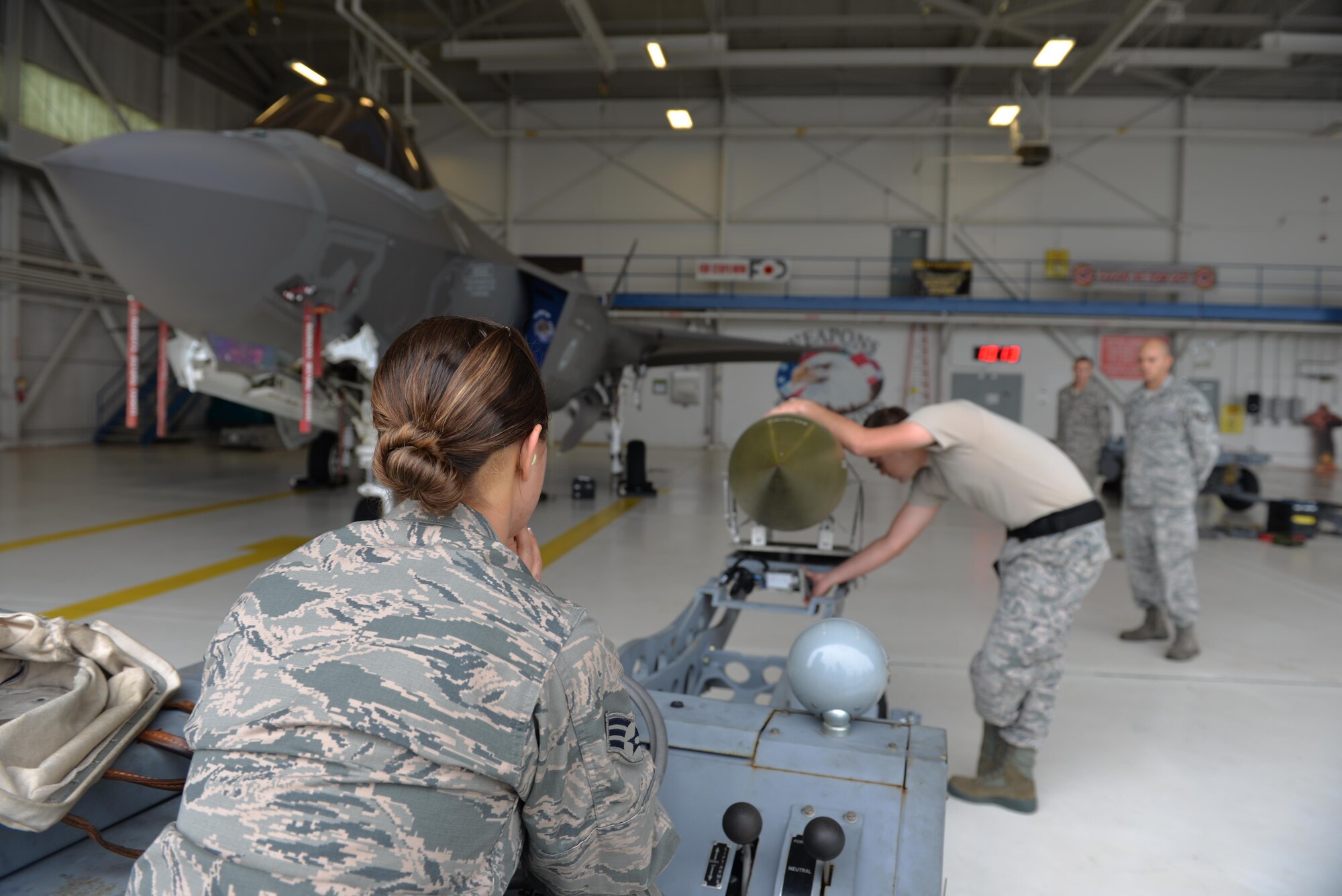 Load crew team four secures a guided bomb unit to a lift truck during a load competition at Eglin Air Force Base, Fla., Jan. 8. Load teams work together to load munitions into an F-35A Lightning II as they are timed and inspected. (U.S. Air Force Photo/Senior Airman Andrea Posey)