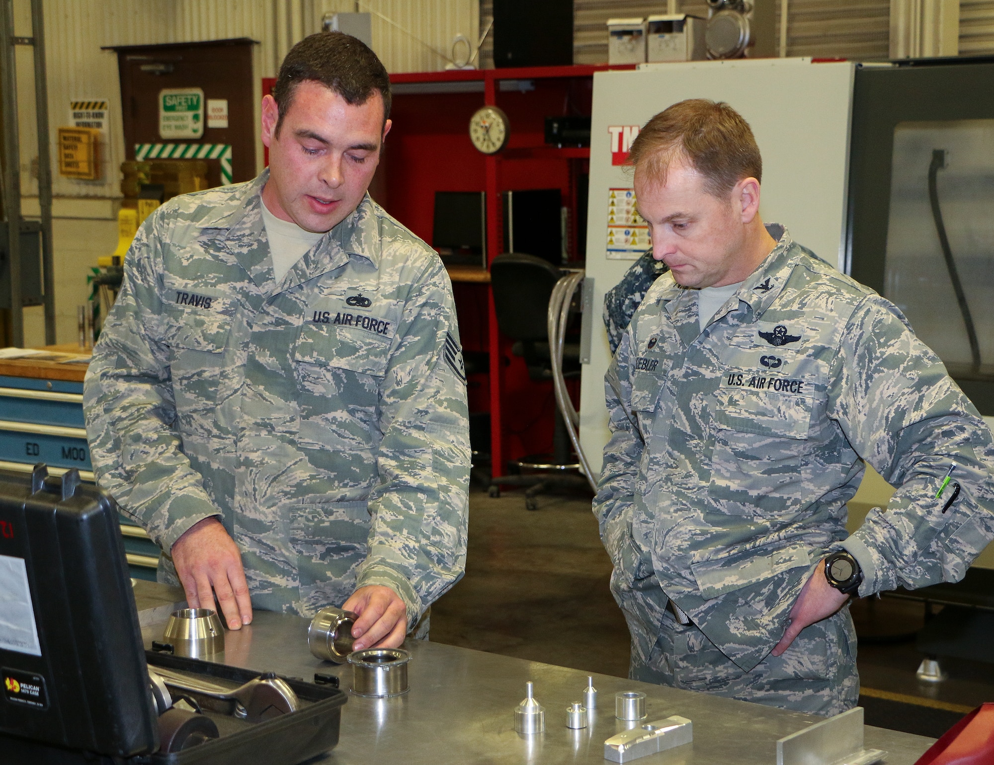 Staff Sgt. Webb Travis, 33rd Maintenance Squadron, talks about the mission of the F-35 fabrication shop with a Commander-In-Chief’s Installation Excellence Award evaluator during a tour of the 33rd Fighter Wing Jan. 15 at Eglin Air Force Base, Fla.  The evaluation team visited many of the base’s support units and areas on the second and final day of their tour.  (U.S. Air Force photo/Irene Freiberg)