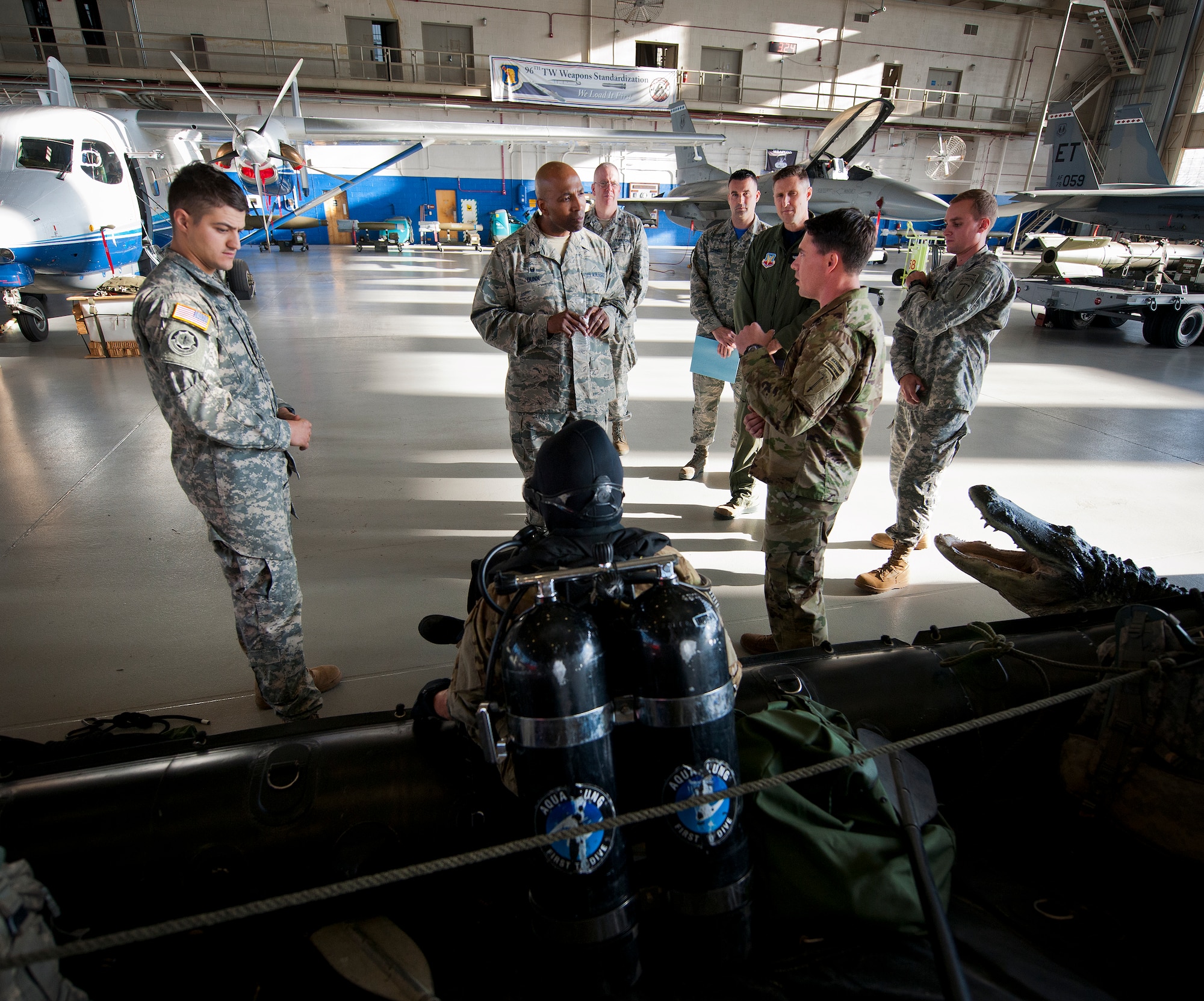 Soldiers from the 6th Ranger Training Battalion speak to a Commander-In-Chief’s Installation Excellence Award evaluator about their swamp mission during the team’s final stop at King Hangar Jan. 15 at Eglin Air Force Base, Fla.  Aircraft and displays from nearly every Team Eglin unit were represented in the hangar to provide a lasting impression of the base before the evaluators left to make their selections of this year’s winner.  (U.S. Air Force photo/Samuel King Jr.)